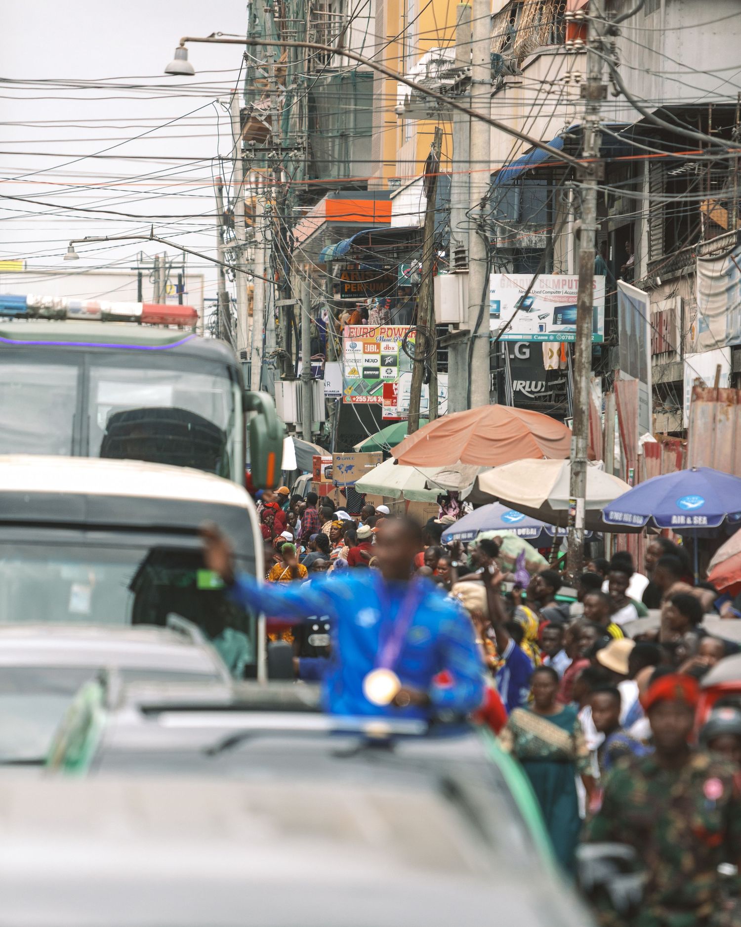 Vibrant street photography print of a busy market street in Dar es Salaam, chaotic and energetic African city wall art by Naezi Eyes.