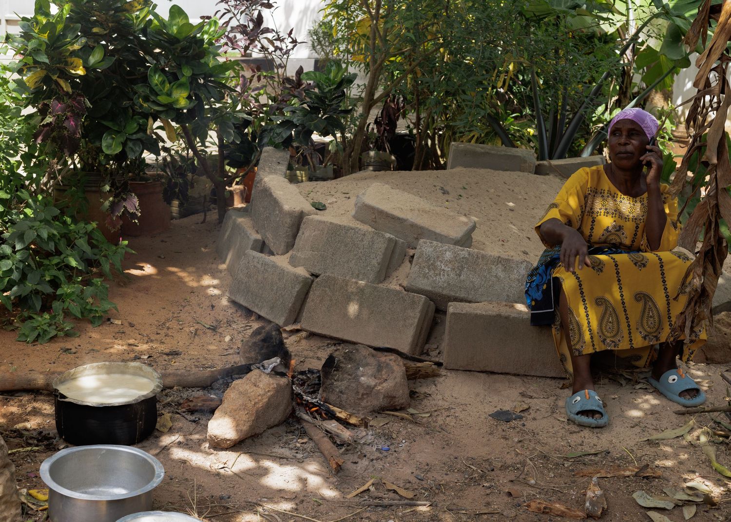 Sun-drying organic charcoal briquettes, a scaling green business project supported by microfinance in Tanzania by Naezi Eyes.