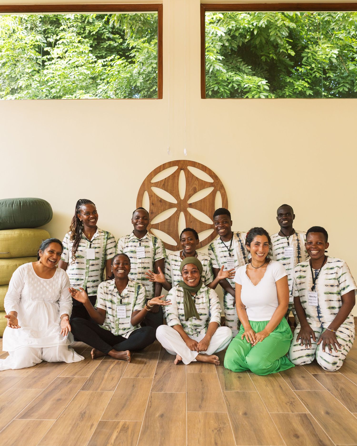Team portrait of Umoja Wellness Sanctuary staff, capturing the community atmosphere of a holistic health center by Naezi Eyes.