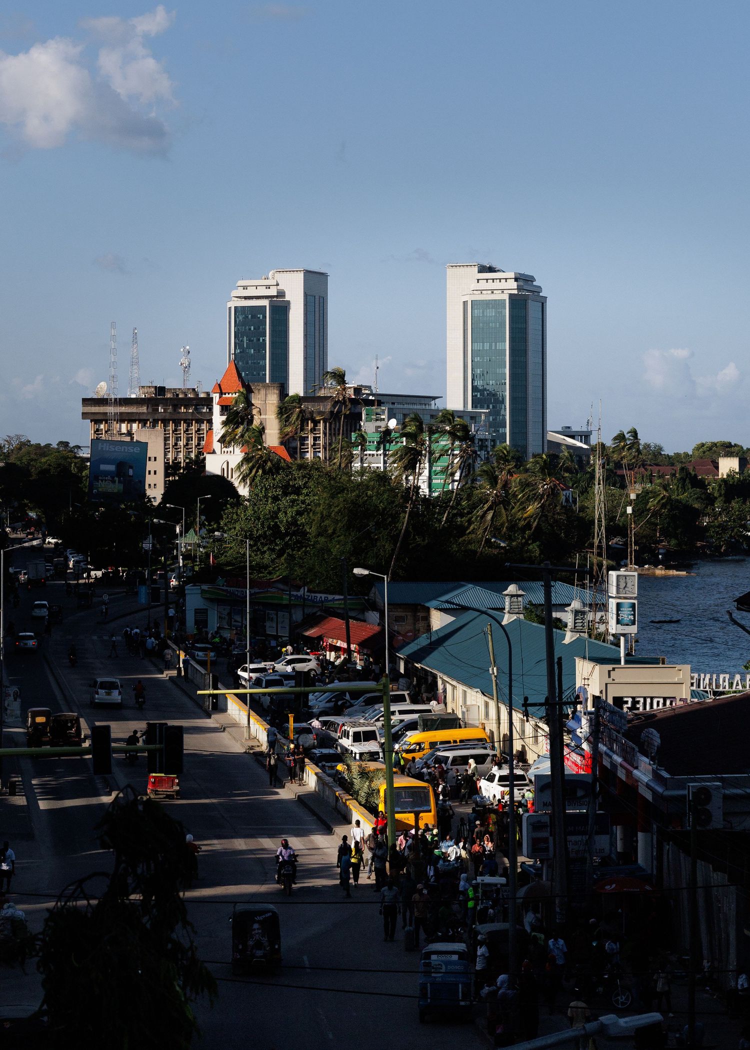 Cityscape photography print of the Dar es Salaam skyline featuring the PSPF Towers, modern African metropolis wall art by Naezi Eyes.