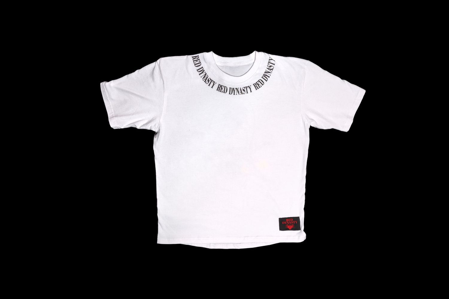 White t-shirt with text around neckline displayed on black background.
