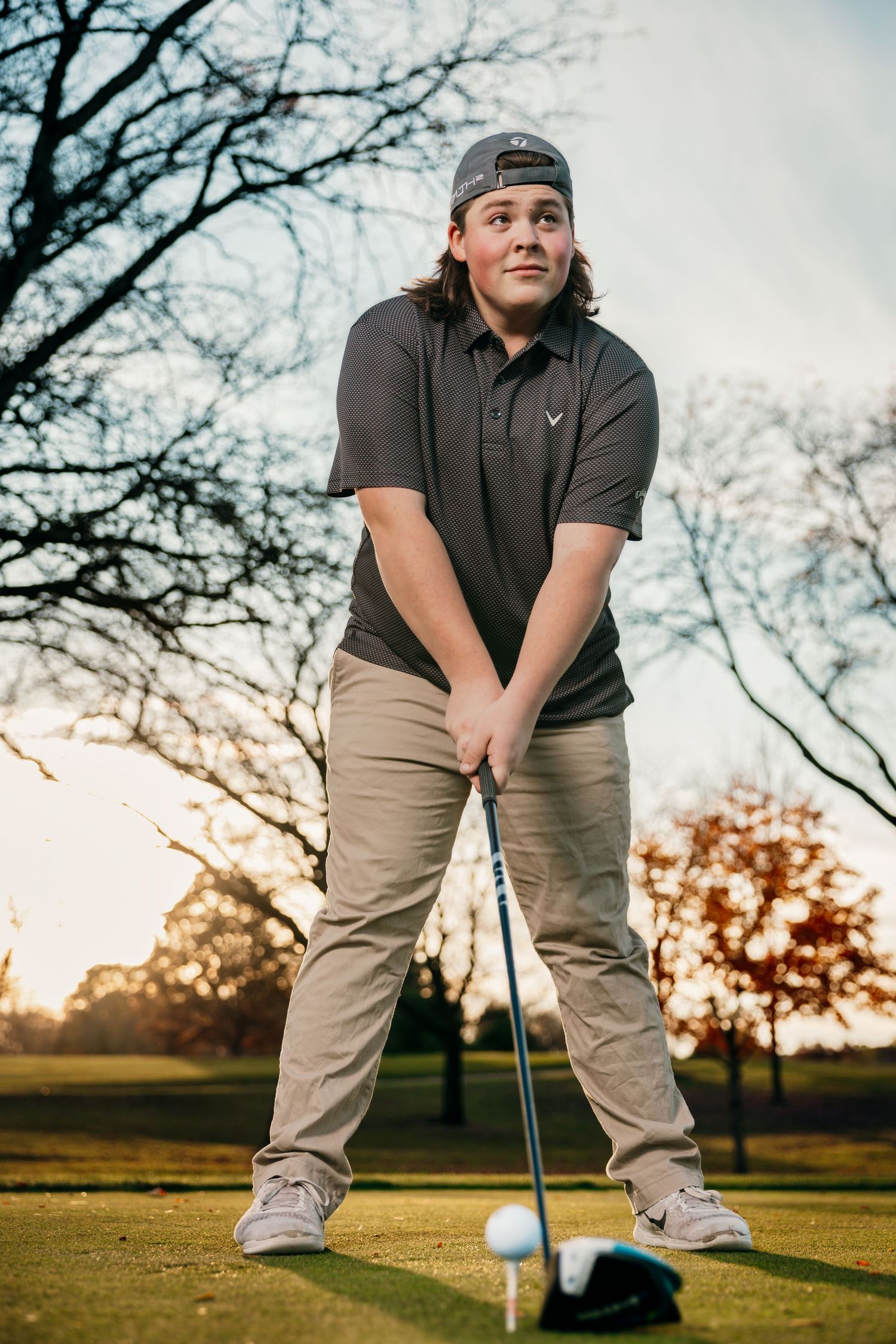 Series of golf putting stance shots on course during sunset.