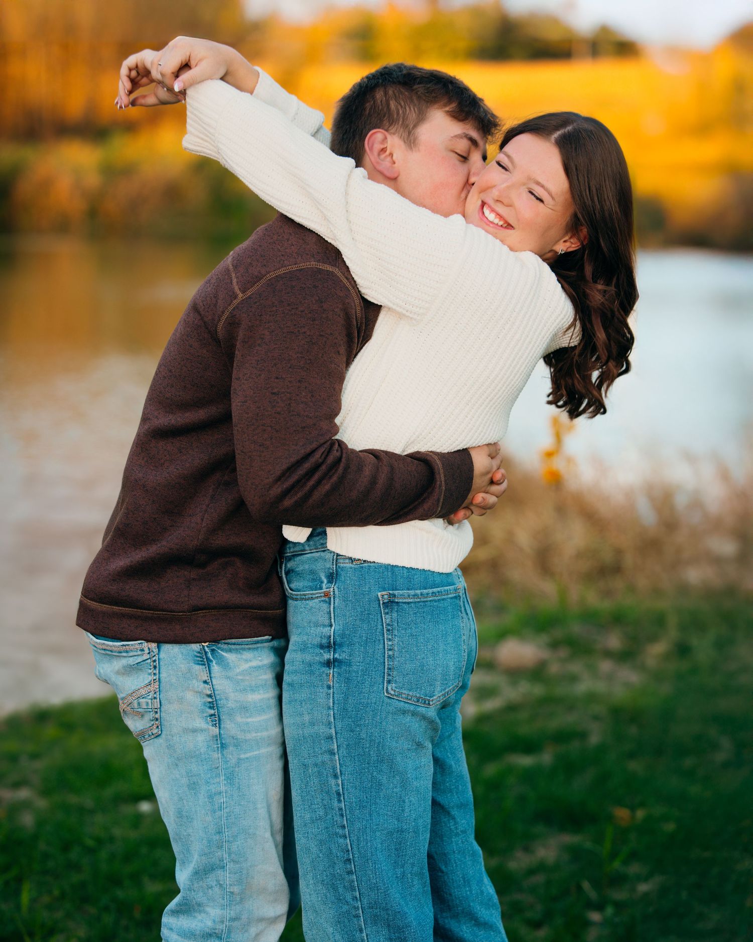 Autumn landscape serves as backdrop for intimate couple portraits.