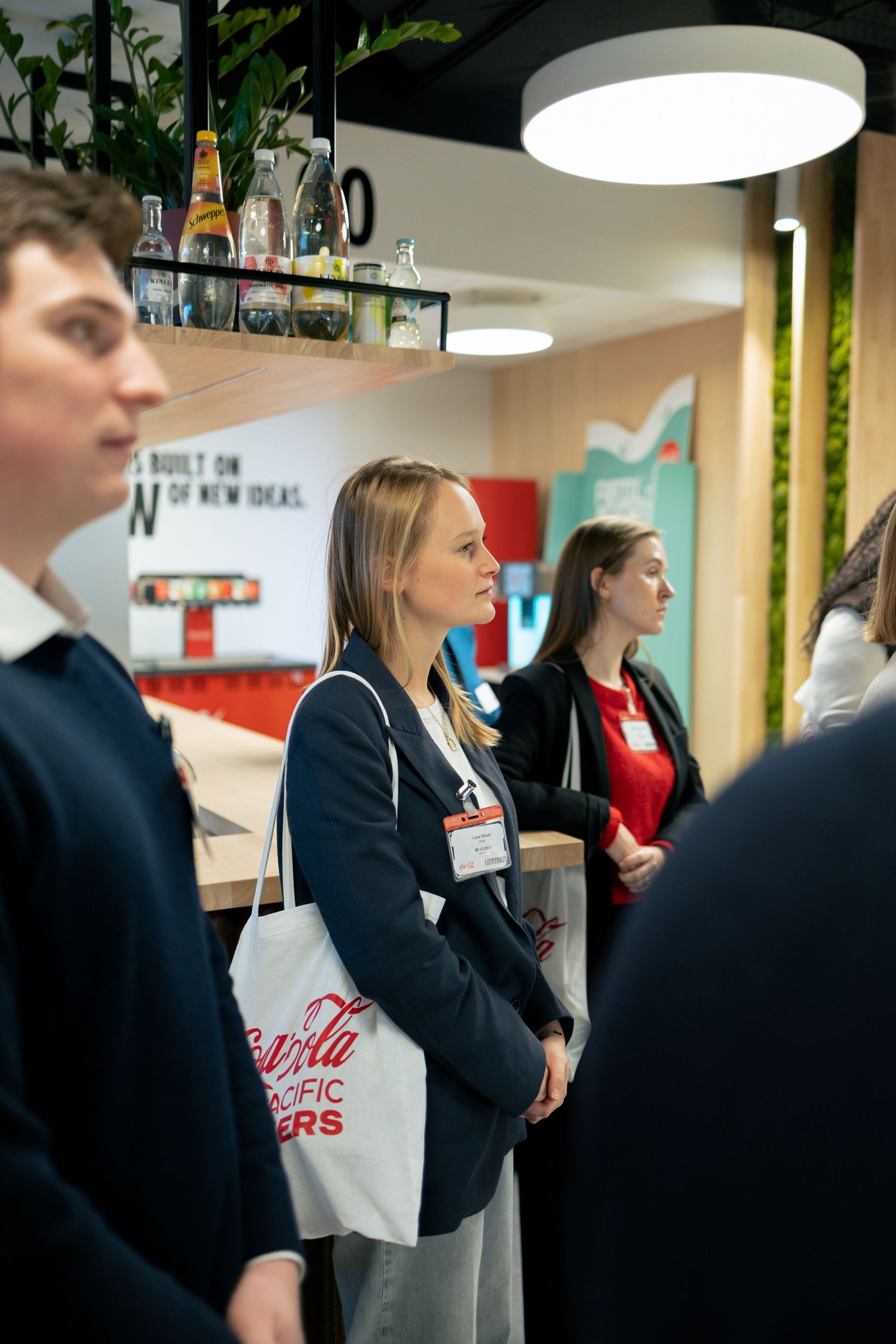 Événement entreprise Coca-Cola à Bruxelles – photographe événementiel corporate, participants en écoute, reportage professionnel spontané.