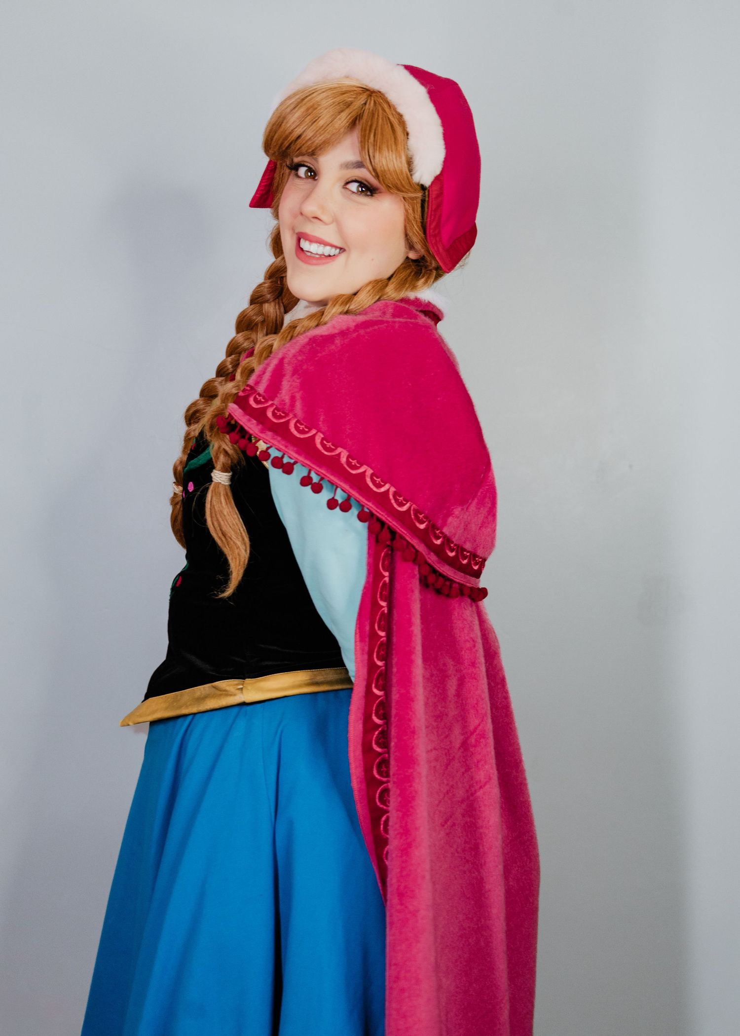 Cosplay portrait series showing a character in blue dress and magenta cape.
