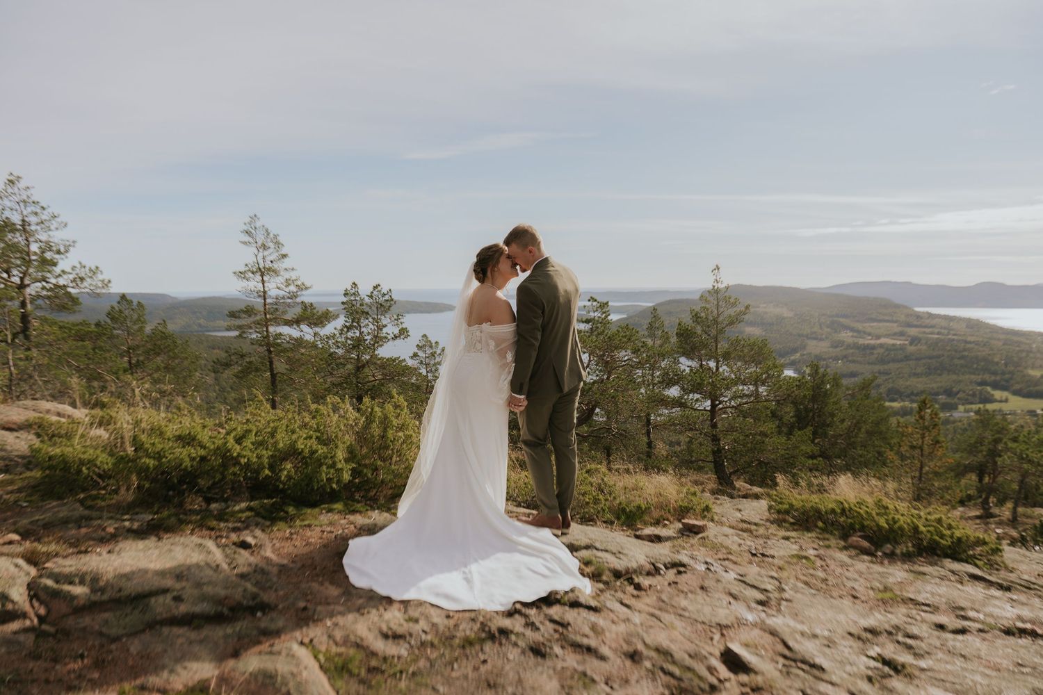 Romantic wedding photography session on a hilltop with sweeping ocean views.