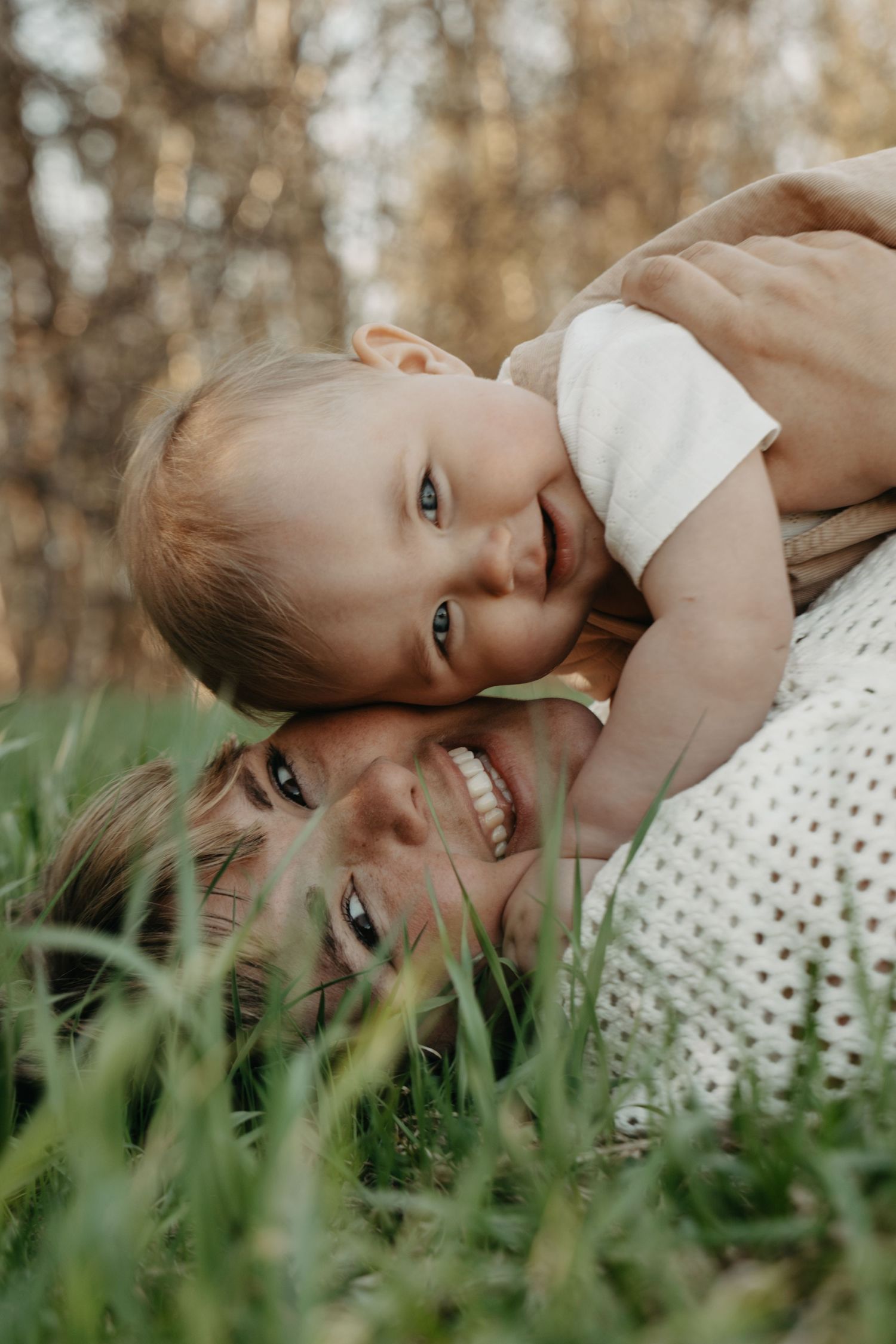 A series of candid portraits showing someone lying in tall grass with a joyful expression and polka dot dress.