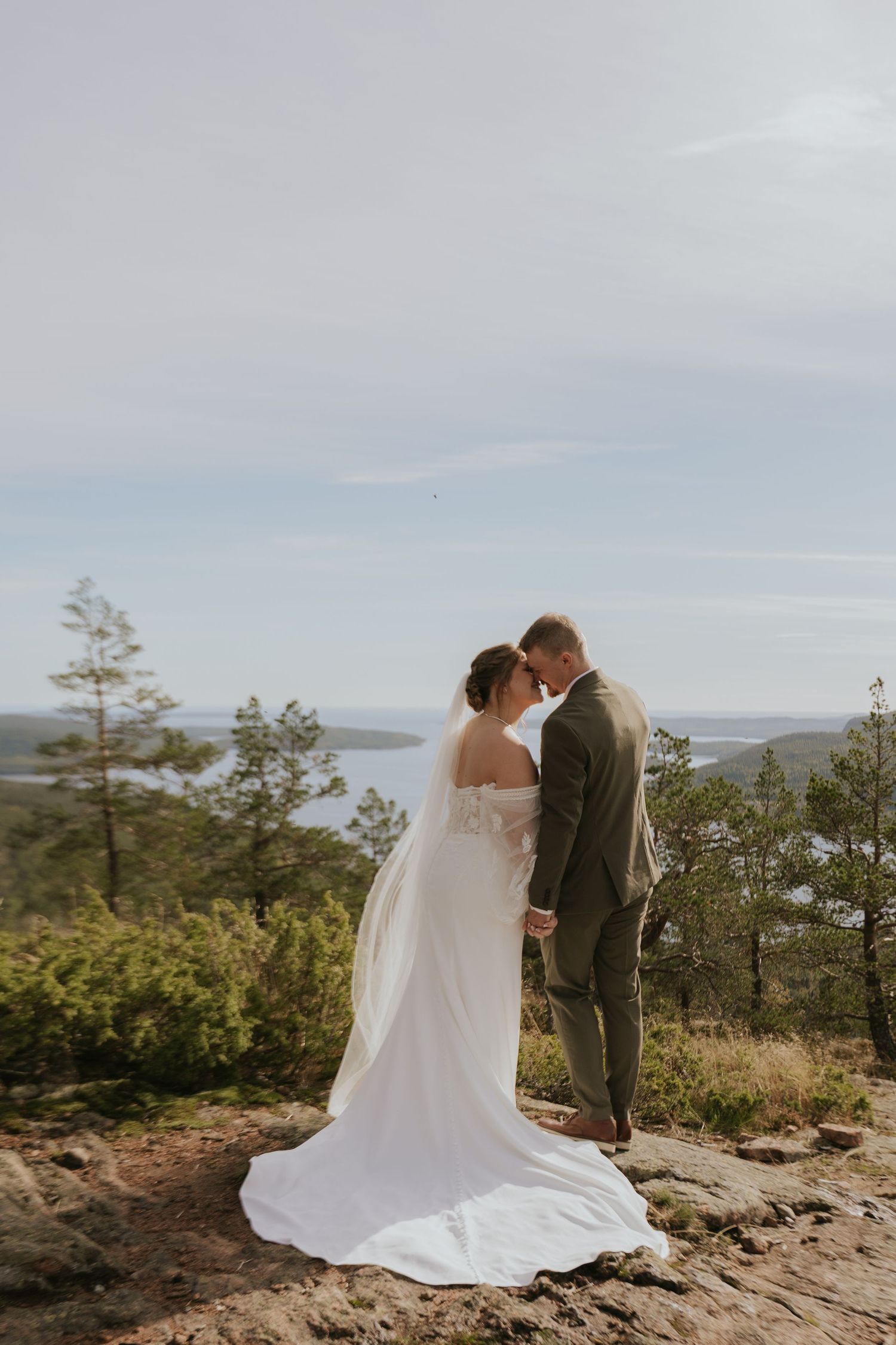 Scenic mountaintop wedding photos with sweeping landscape views in the background.