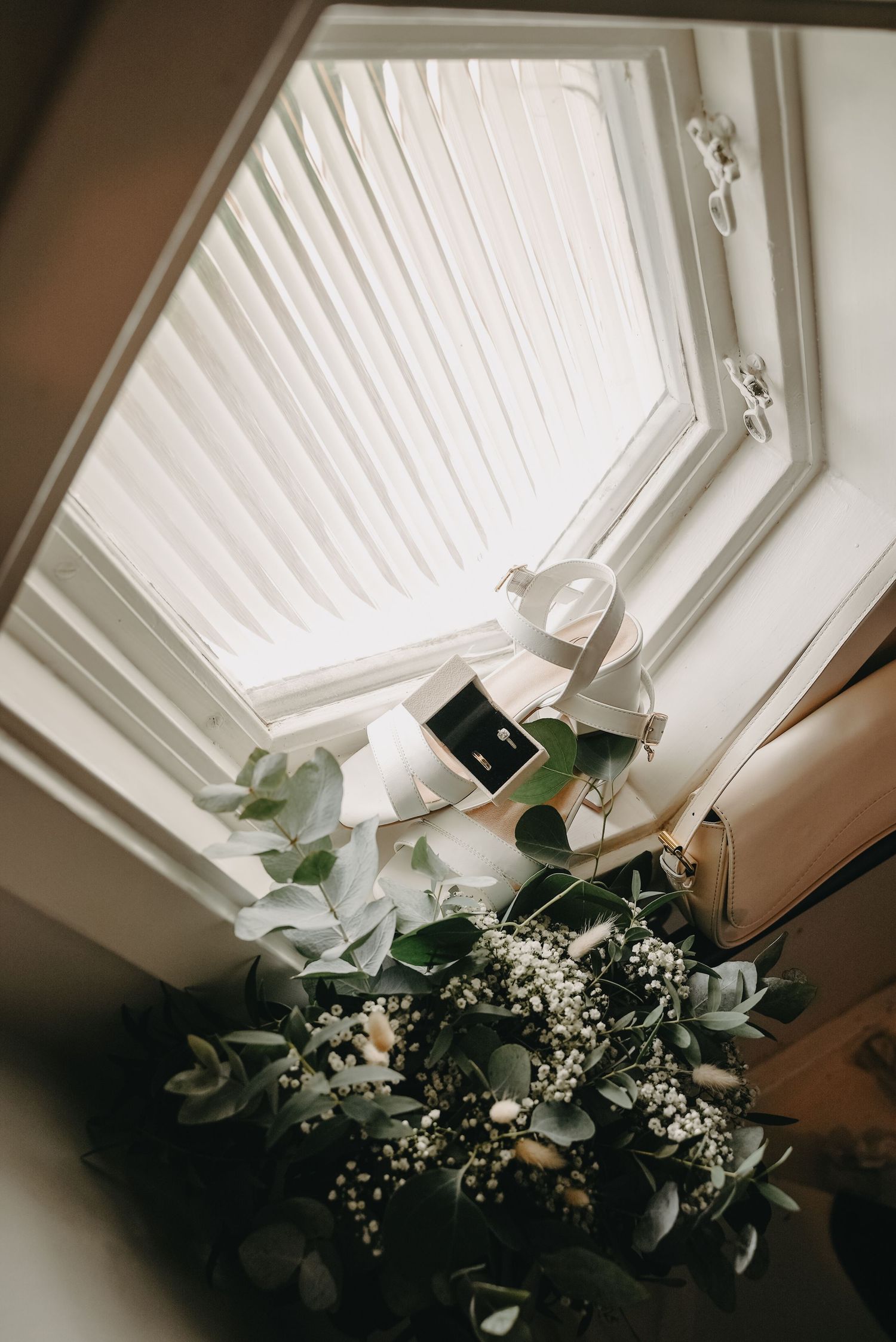 A sequence of photos showing a white octagonal window with delicate floral arrangements in the corner against a cream wall.