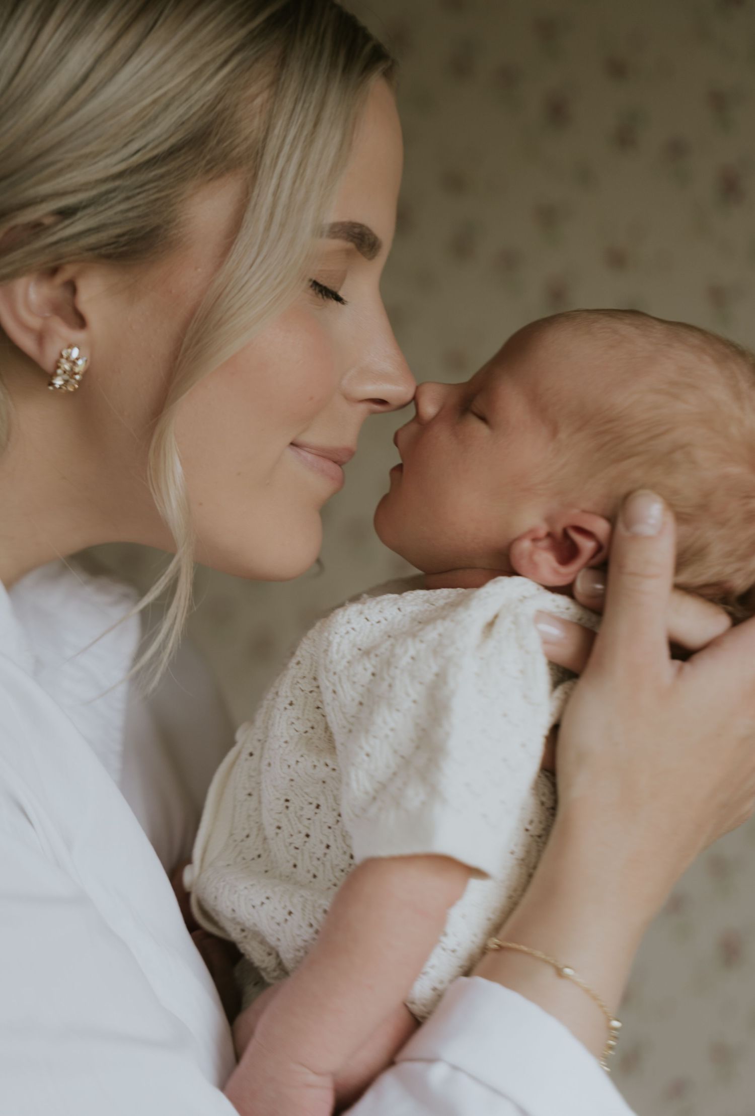 A tender sequence of intimate moments between parent and child in soft, muted tones.