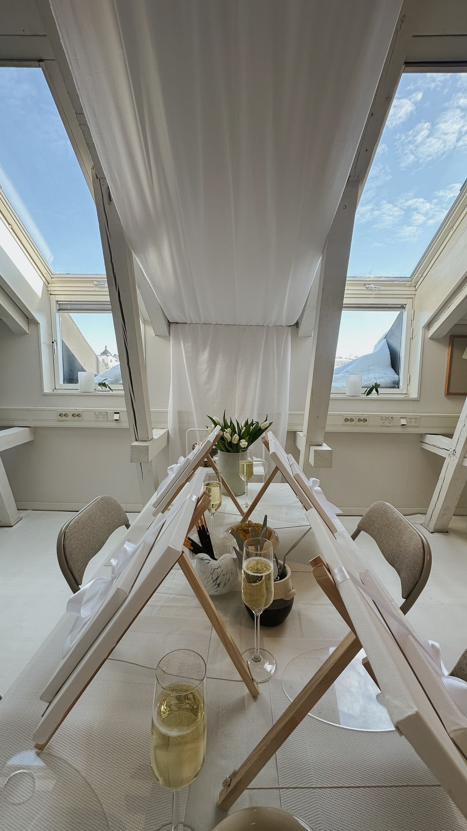 Sequence of skylight windows in a modern white room with wine glasses and minimalist decor showing different angles.