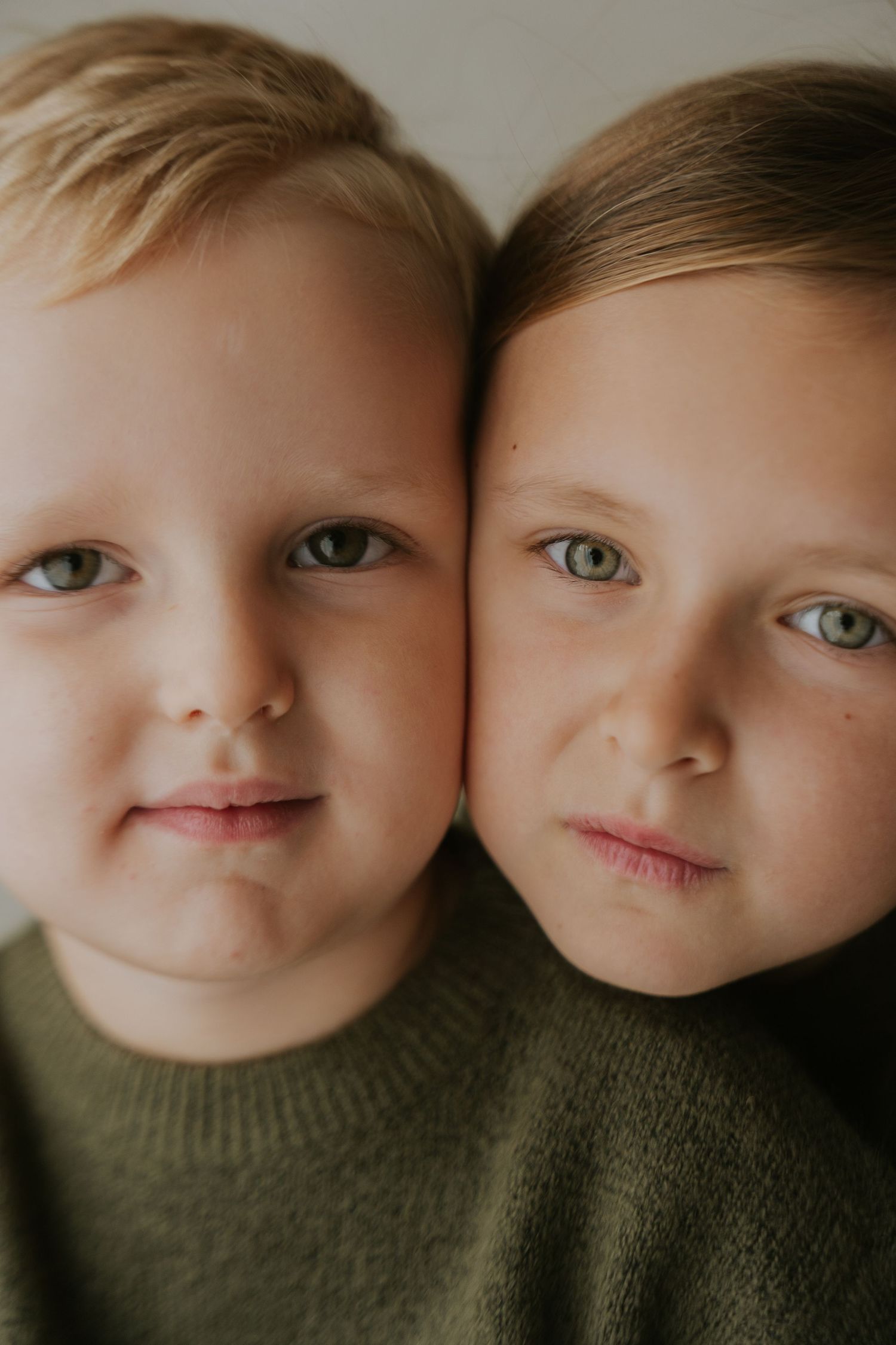 Close-up portrait series showing two faces side by side in warm lighting.