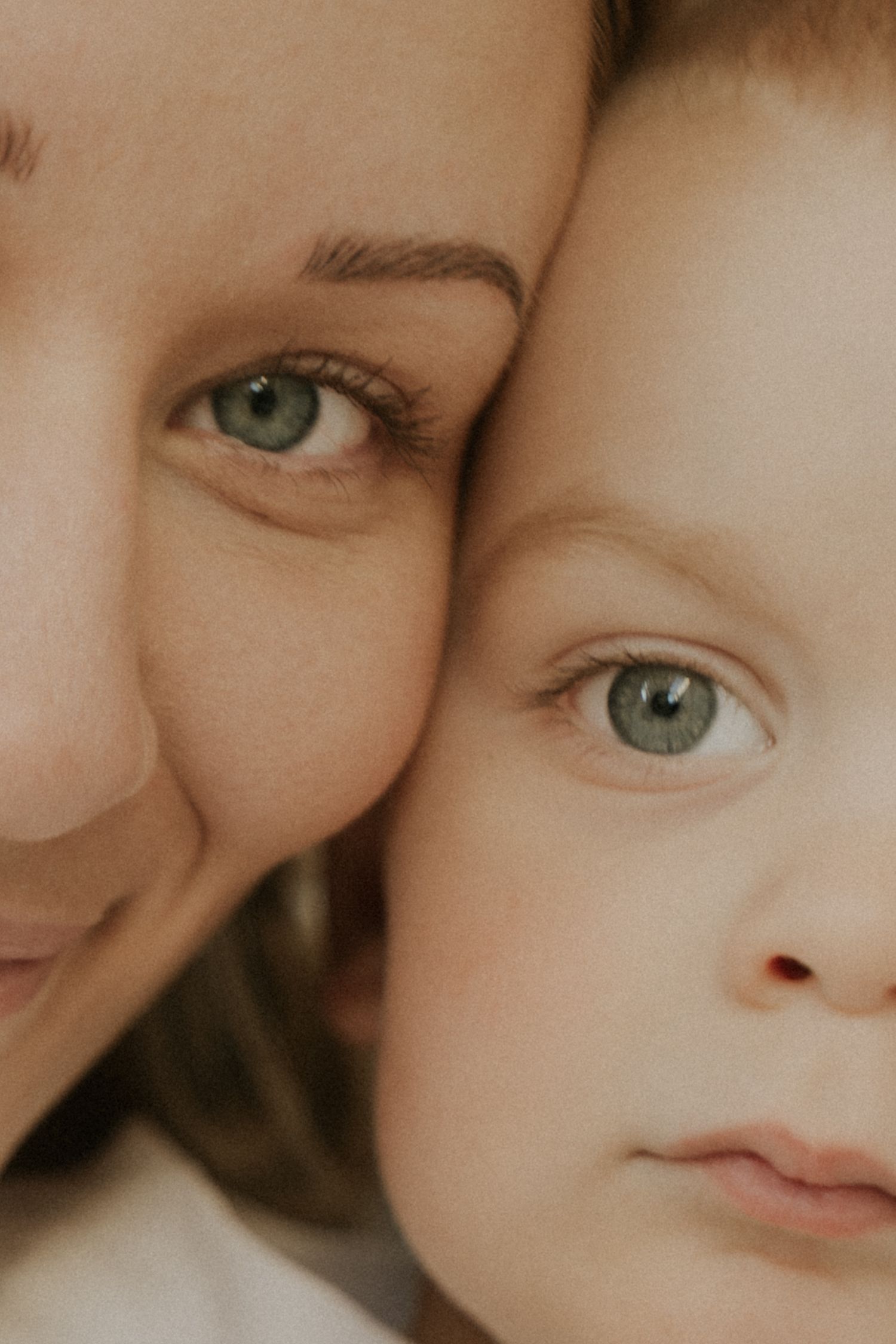 A close-up montage showing parts of faces with bright green eyes and soft, warm lighting.
