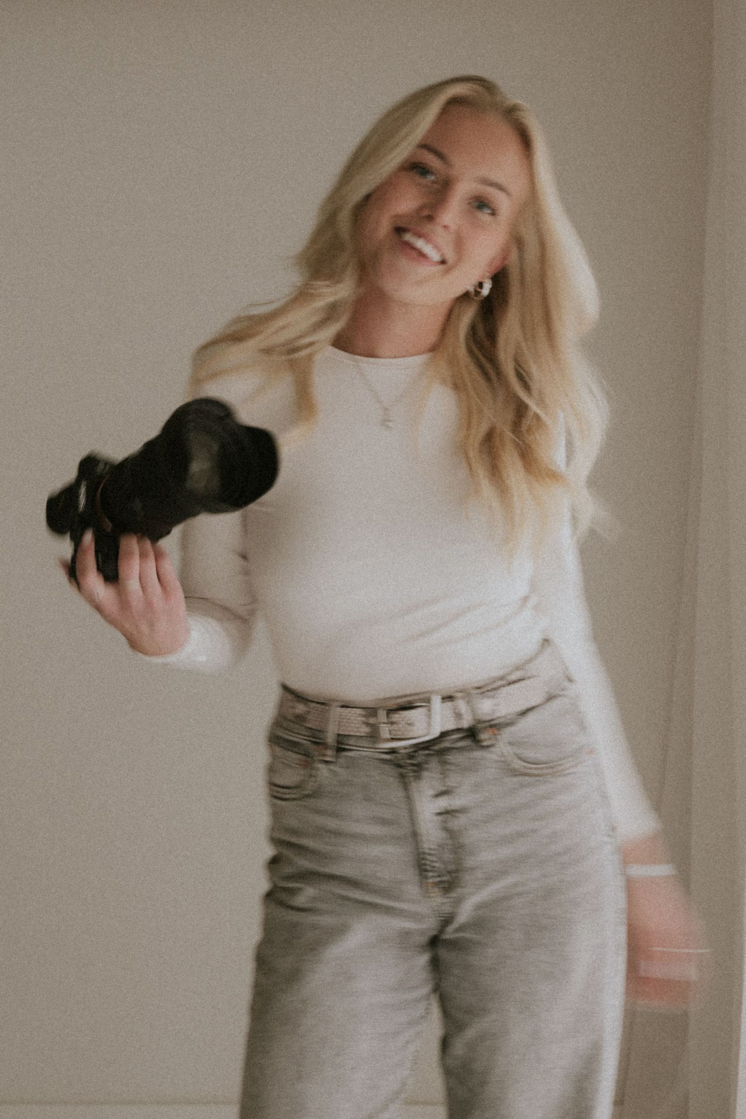 A person in a white turtleneck and light jeans poses playfully in a sequence of casual lifestyle photos.