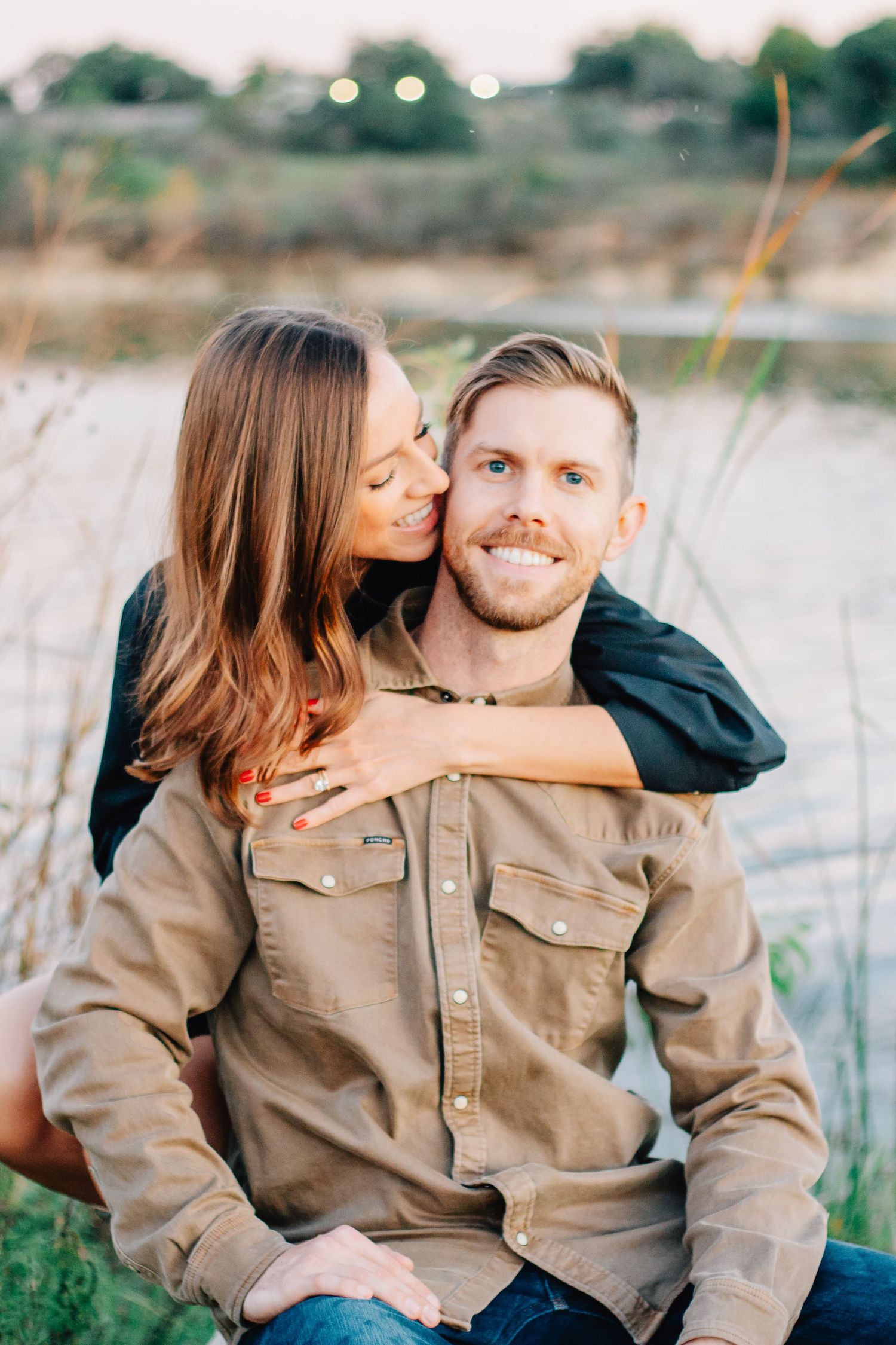 Romantic couple sharing intimate moments during an outdoor photo session.