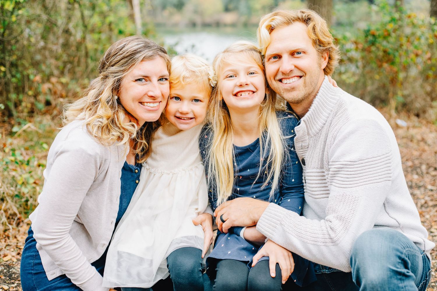 Family photo session capturing authentic moments in a park setting.
