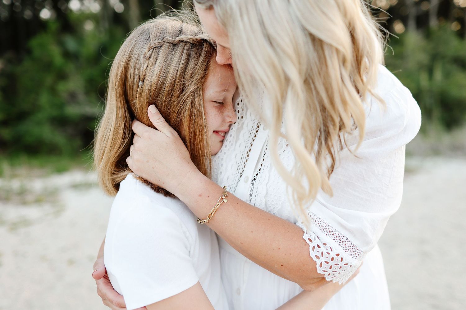 Hilton Head family photography capturing a meaningful mother and daughter moment at Fish Haul Beach