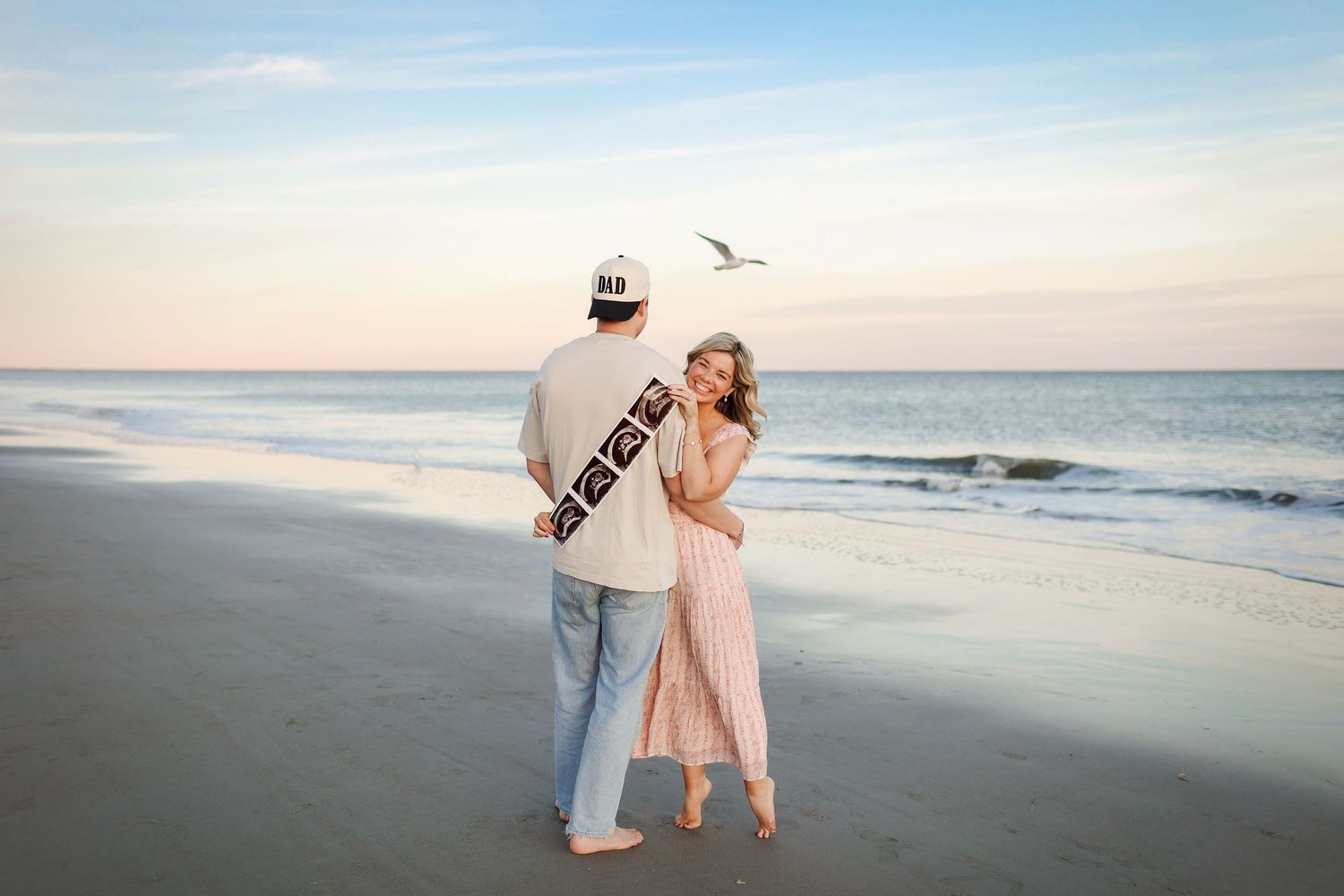Hilton Head maternity and couples photography session with pregnancy announcement at Folly Field Beach on Hilton Head Island