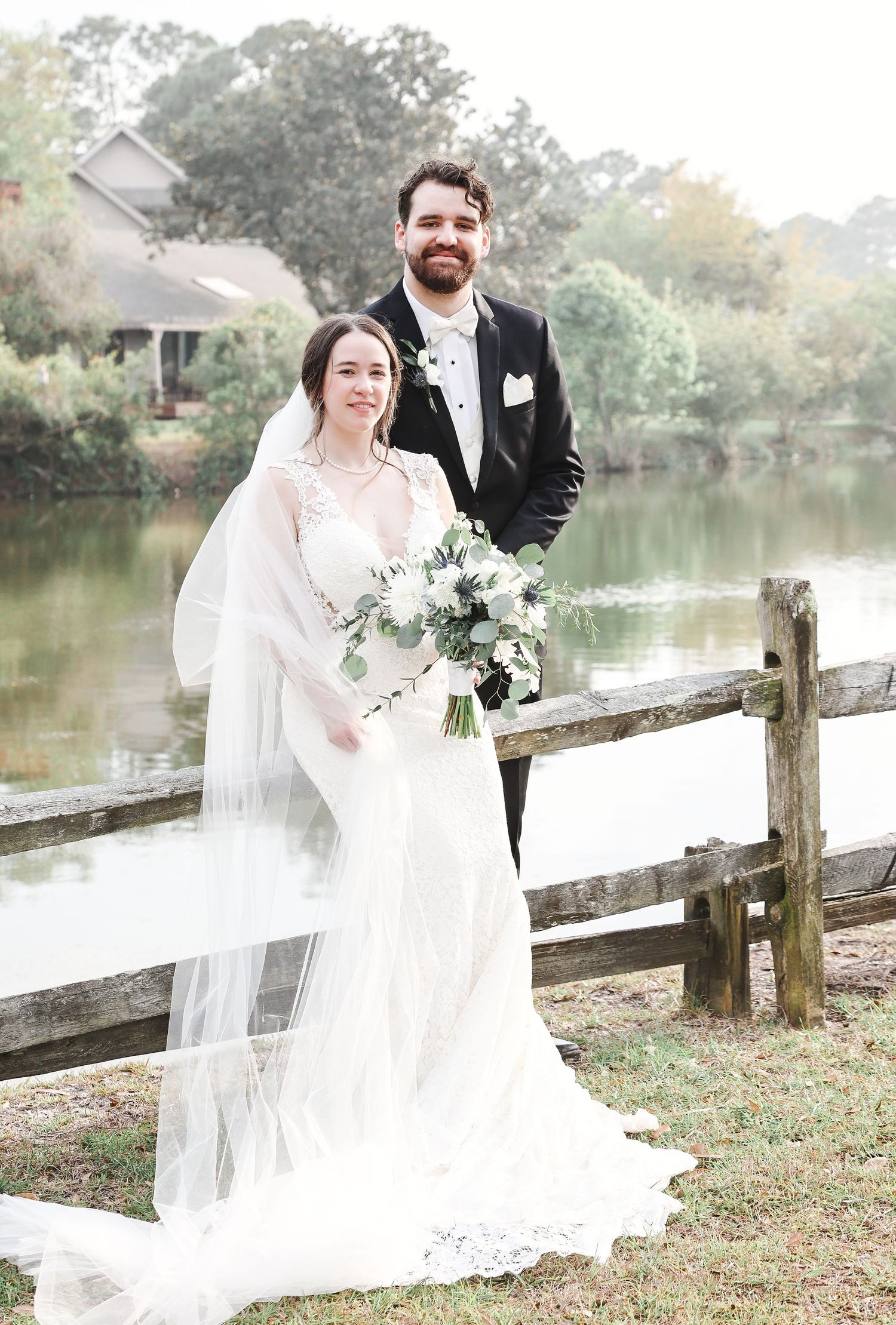 Newly married couple sharing a quiet moment by a lagoon during Hilton Head wedding photography portraits