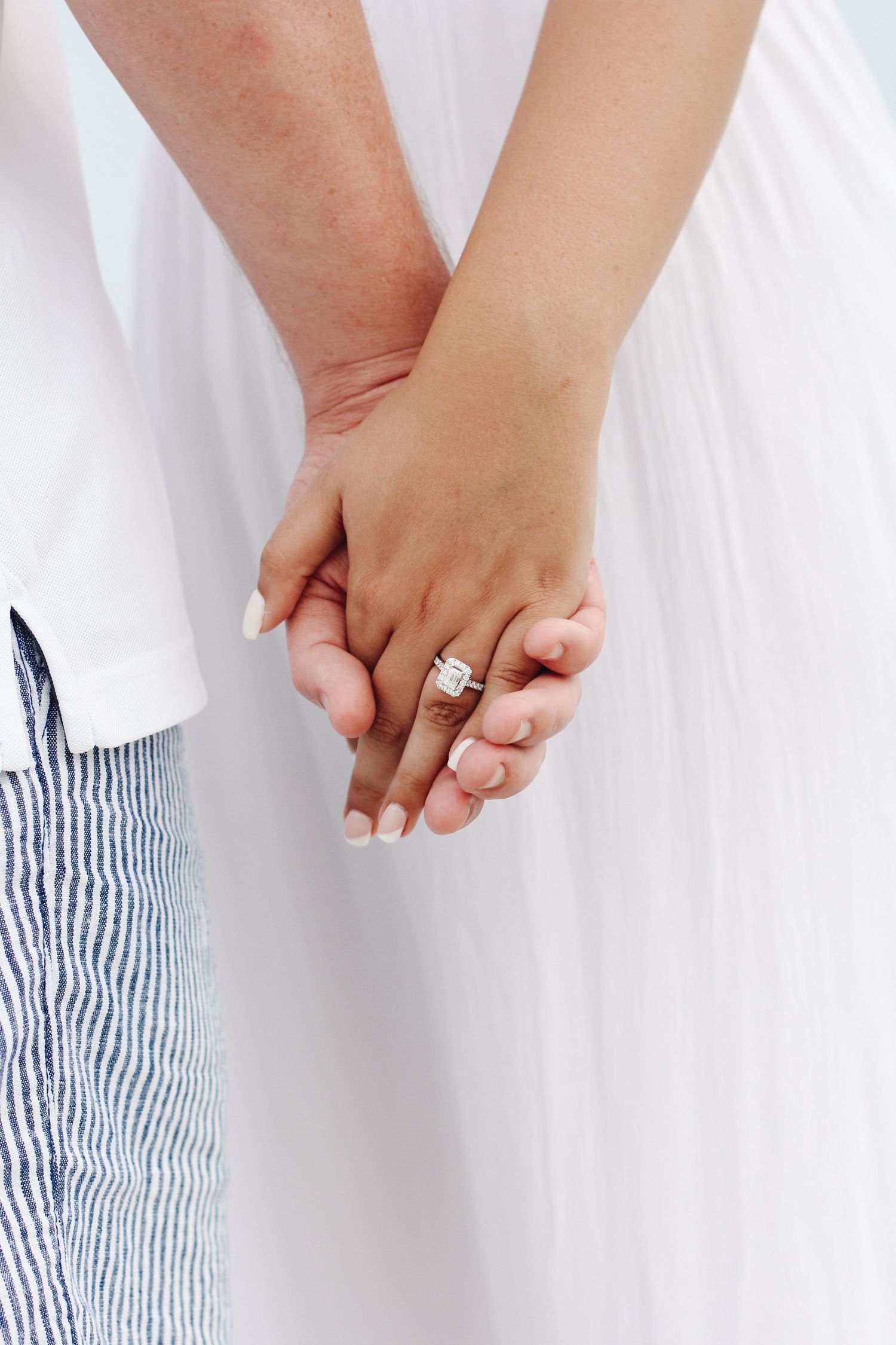 Close-up of engagement ring during Hilton Head engagement photography session at the beach