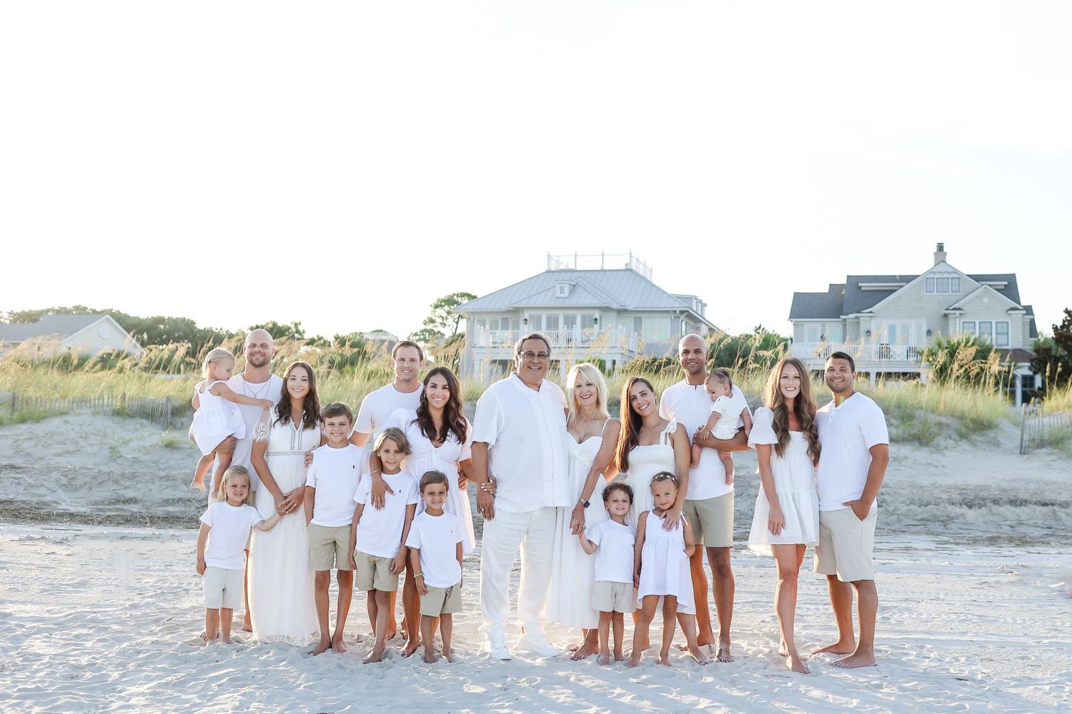 Extended family photography on Hilton Head Island with large family dressed in white along North Forest Beach dunes
