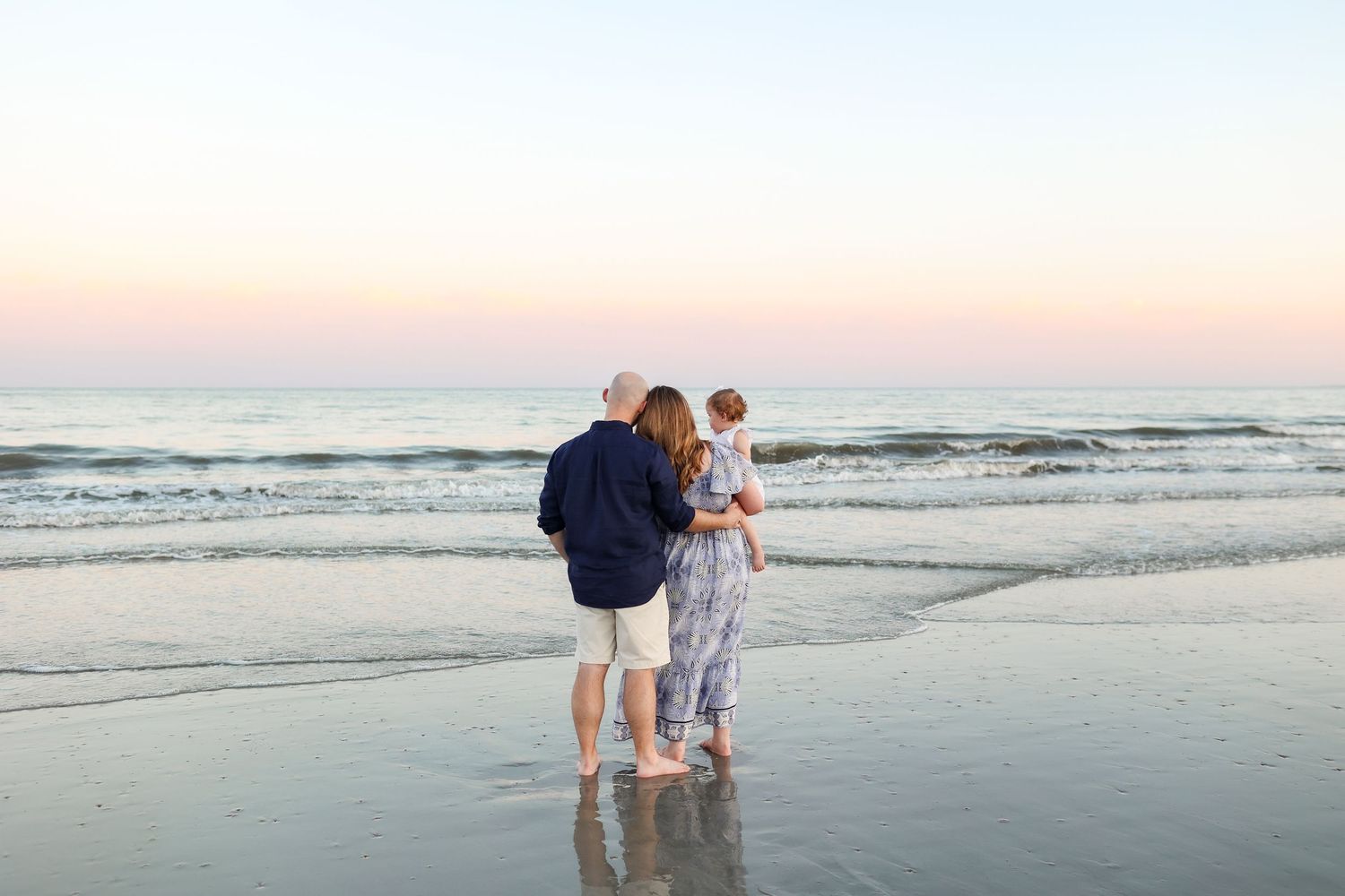 Family watching sunset at Sea Pines Beach Club during a Hilton Head family photography session
