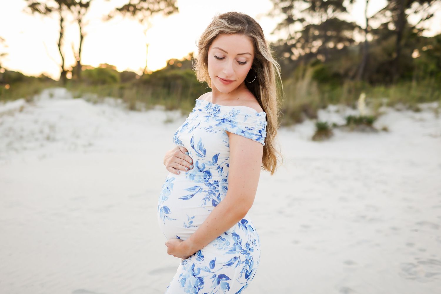 Hilton Head maternity photography portrait at Sea Pines Beach Club, capturing a graceful moment on the beach