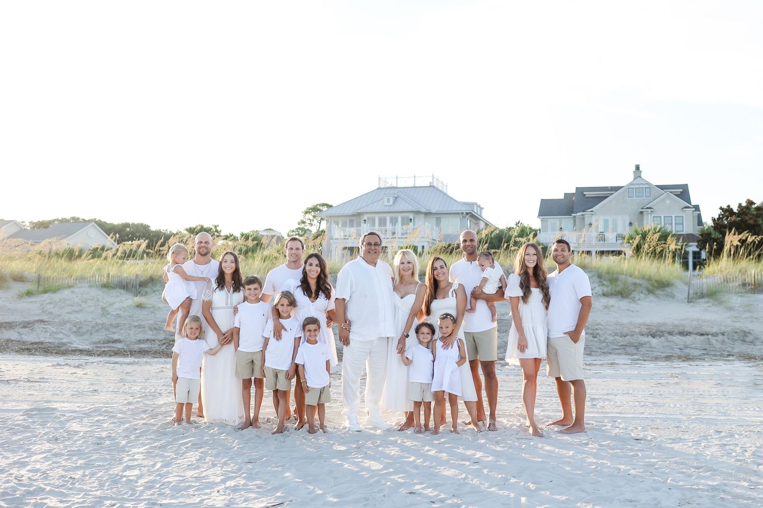 Family reunion photos on Hilton Head Island with large extended family gathered together on the beach at sunset