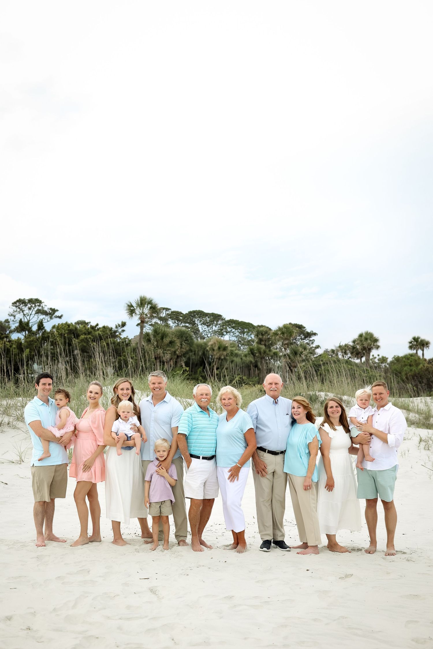 Extended family reunion photos at Sea Pines Beach Club on Hilton Head, large family posing in sand dunes in soft evening light