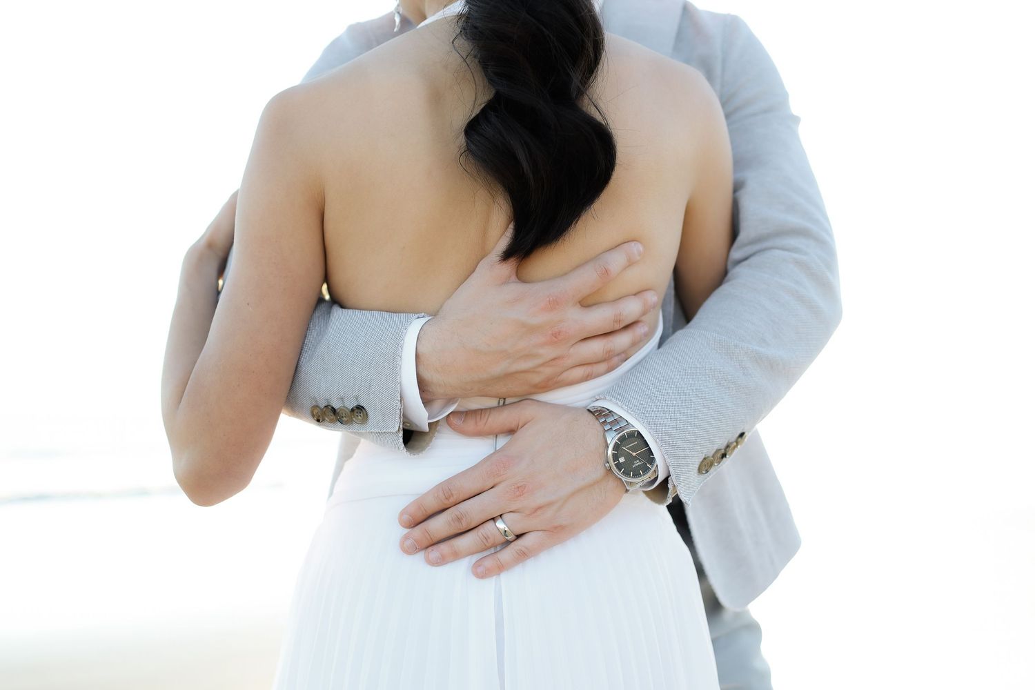 Bride and groom embraced at Tower Beach during intimate Hilton Head elopement photography