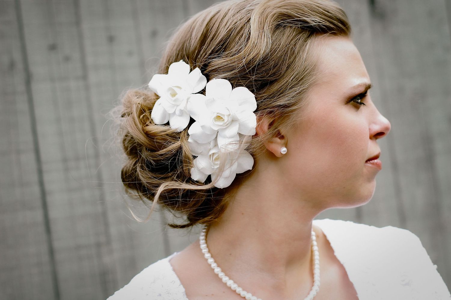 Bride showing gardenias in her updo during Hilton Head elopement photography portraits
