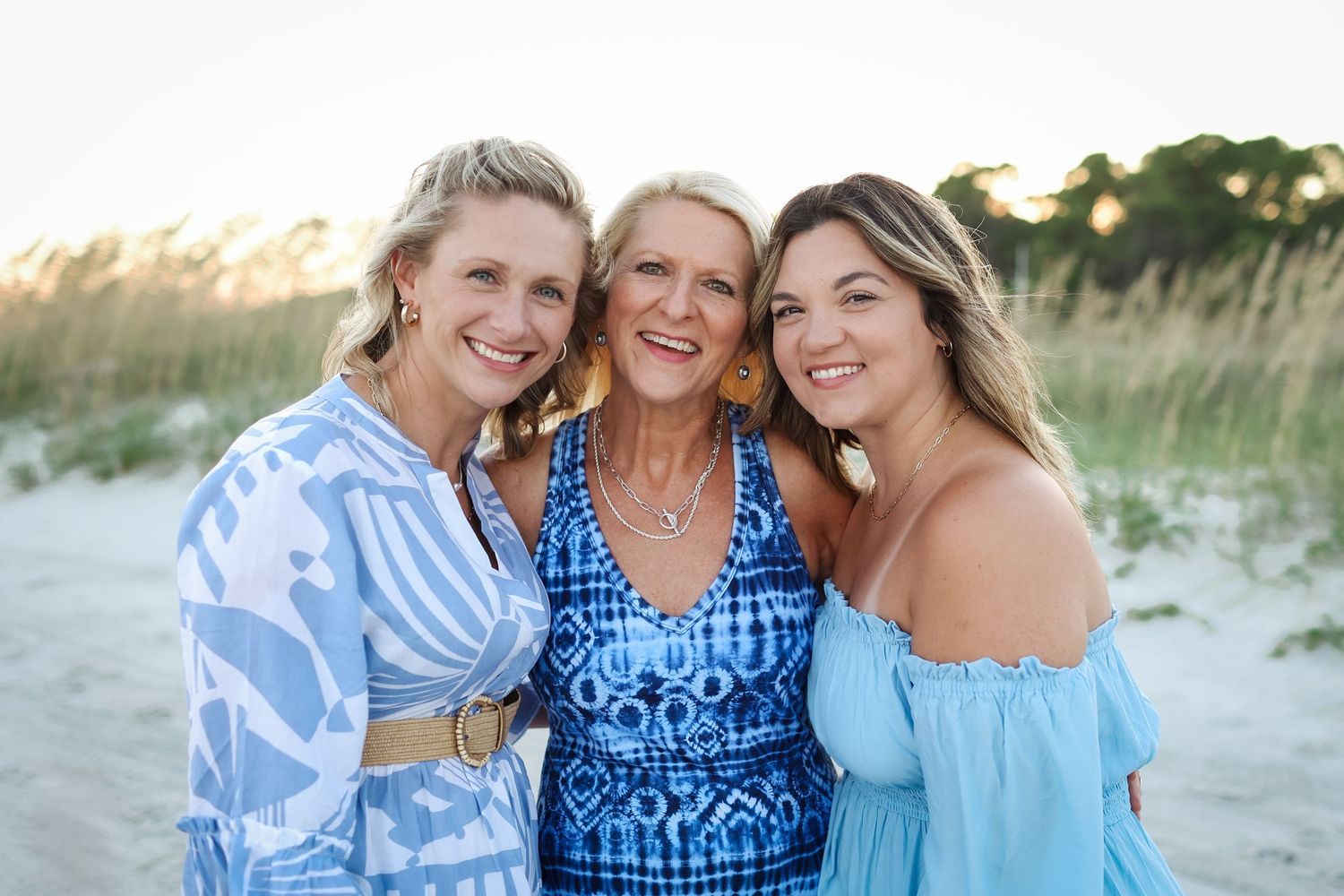 Extended family photos on Hilton Head Island, mother posing with daughters during family reunion at sunset