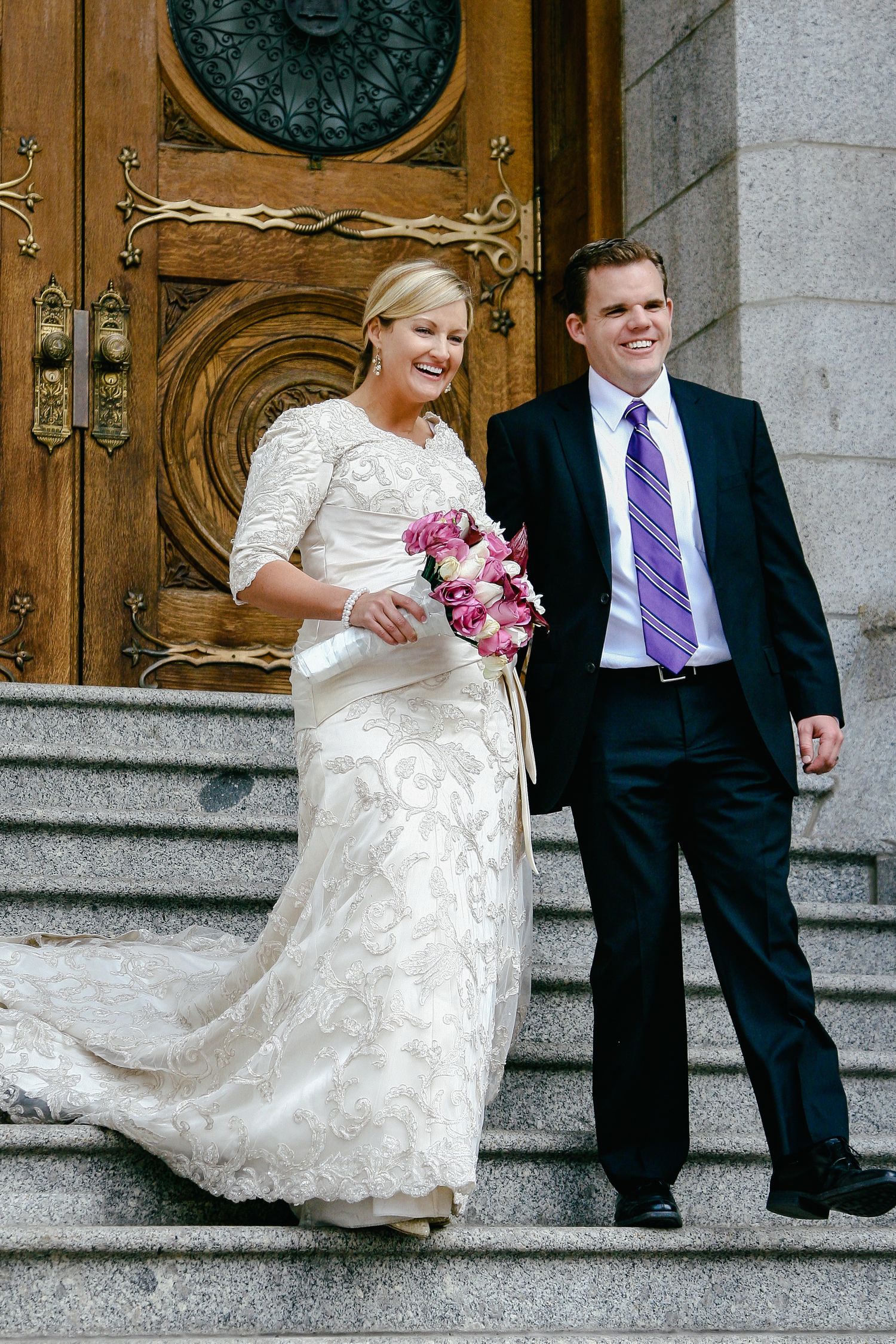 Newly married couple walking down stairs after their wedding, photographed naturally by Hilton Head elopement photographer
