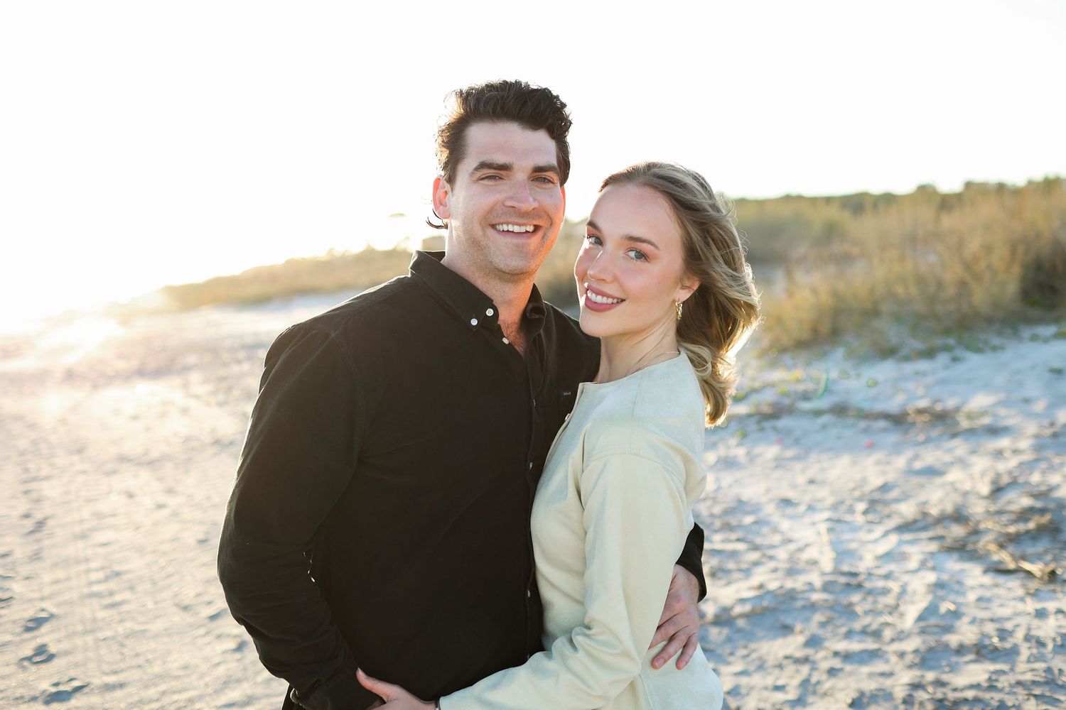 Couple smiling during photography session at Coligny Beach on Hilton Head Island