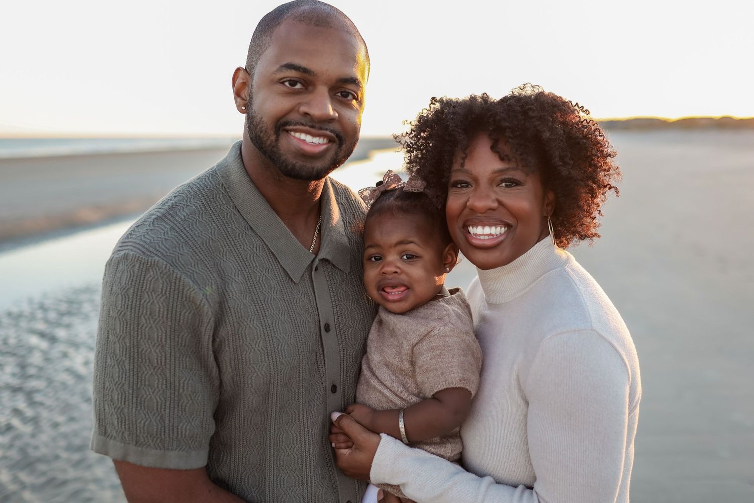Hilton Head Island family photography featuring parents and baby during a sunset beach session at Burkes Beach