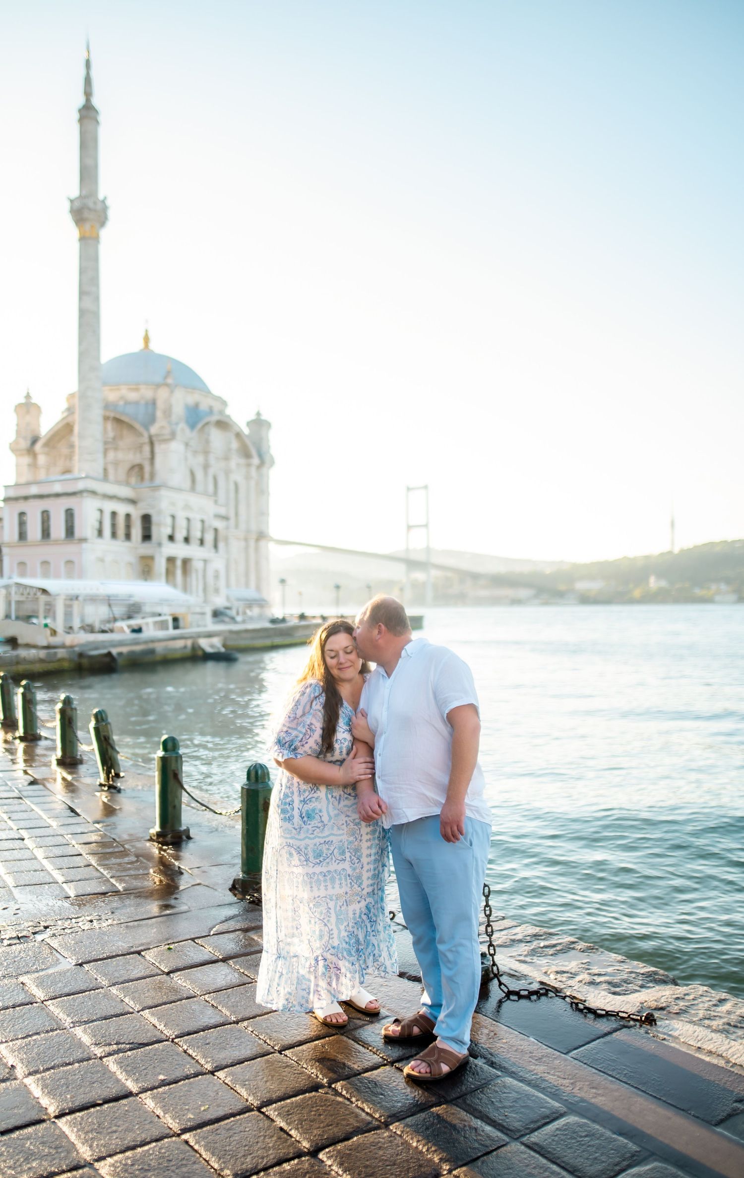 Krista Ercin-Maurer and her husband Erman standing near a mosque on the Bosphorus at sunrise