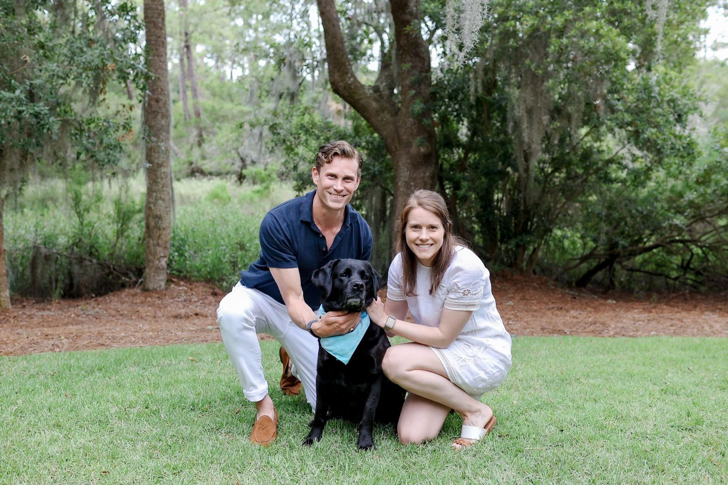 Dog-friendly engagement photography on Hilton Head Island, couple with black lab under Spanish moss