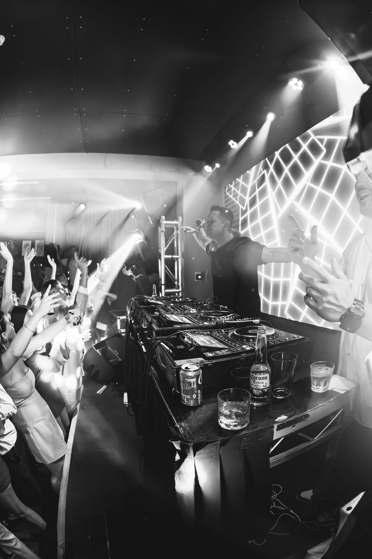 Black and white fisheye photo of The Stafford Brothers performing to energetic crowd at The Beach Hotel Merewether.