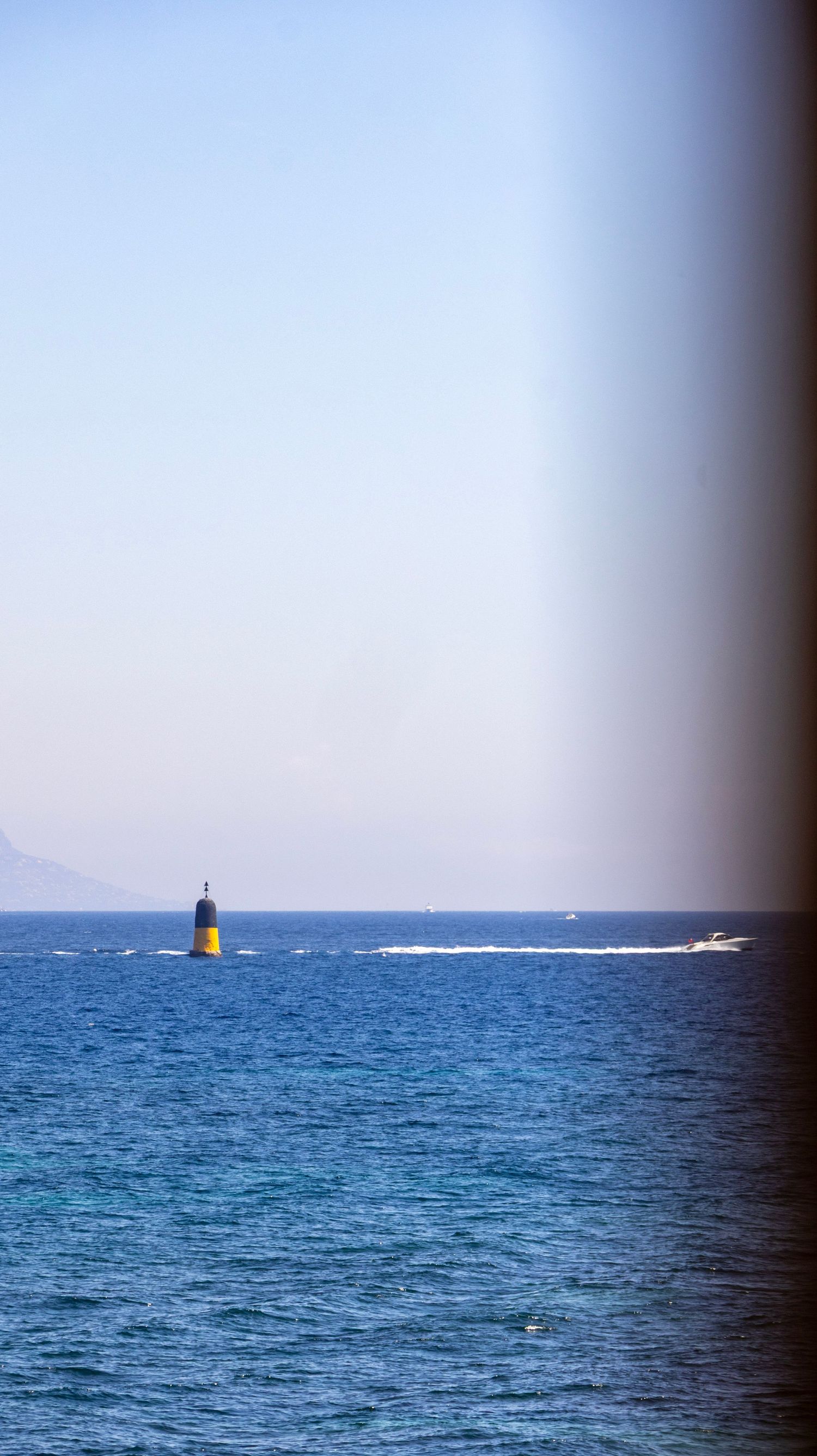 sea view with a boat passing by