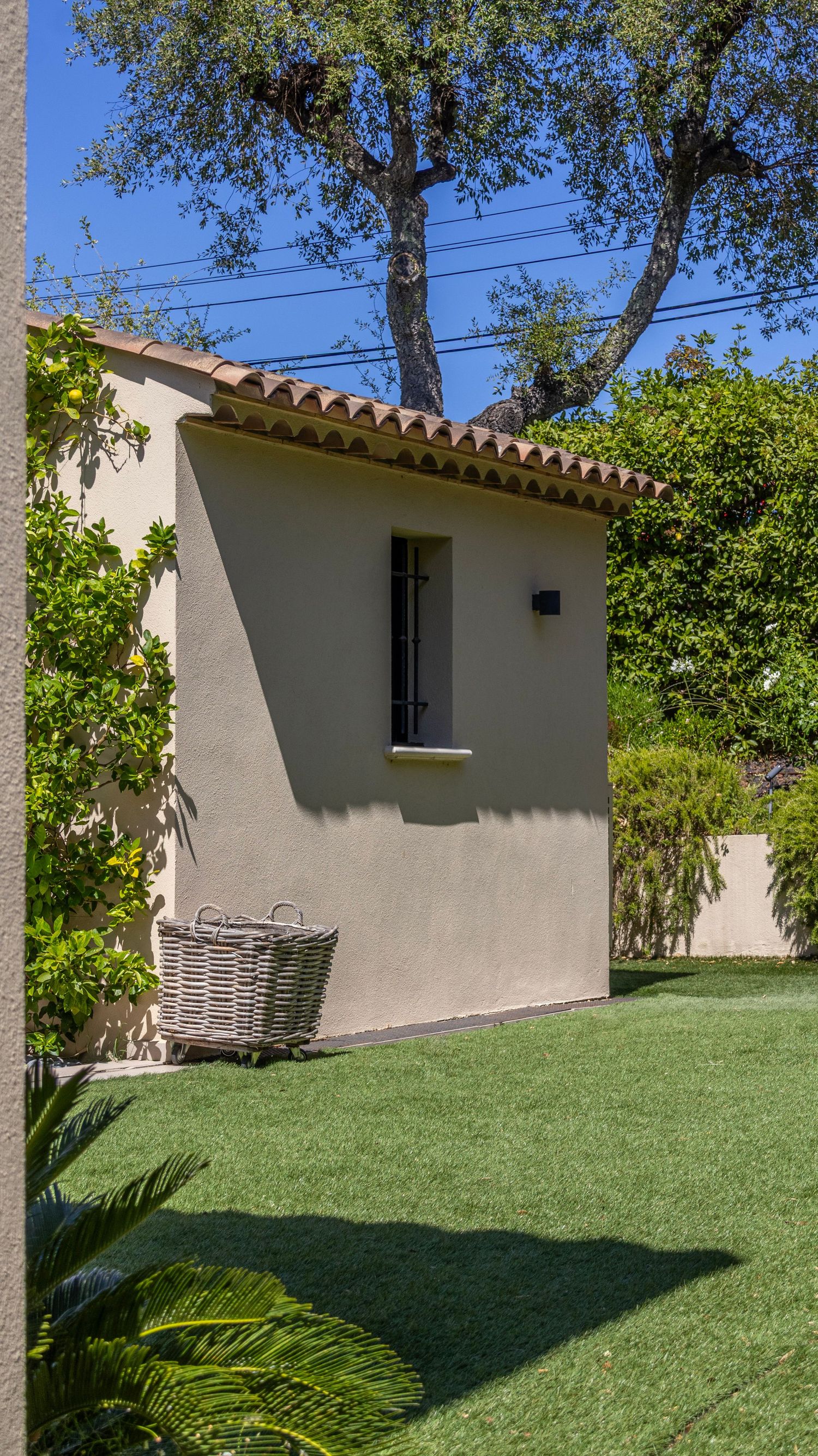 shadow covering the outside wall of this beautiful provençale villa