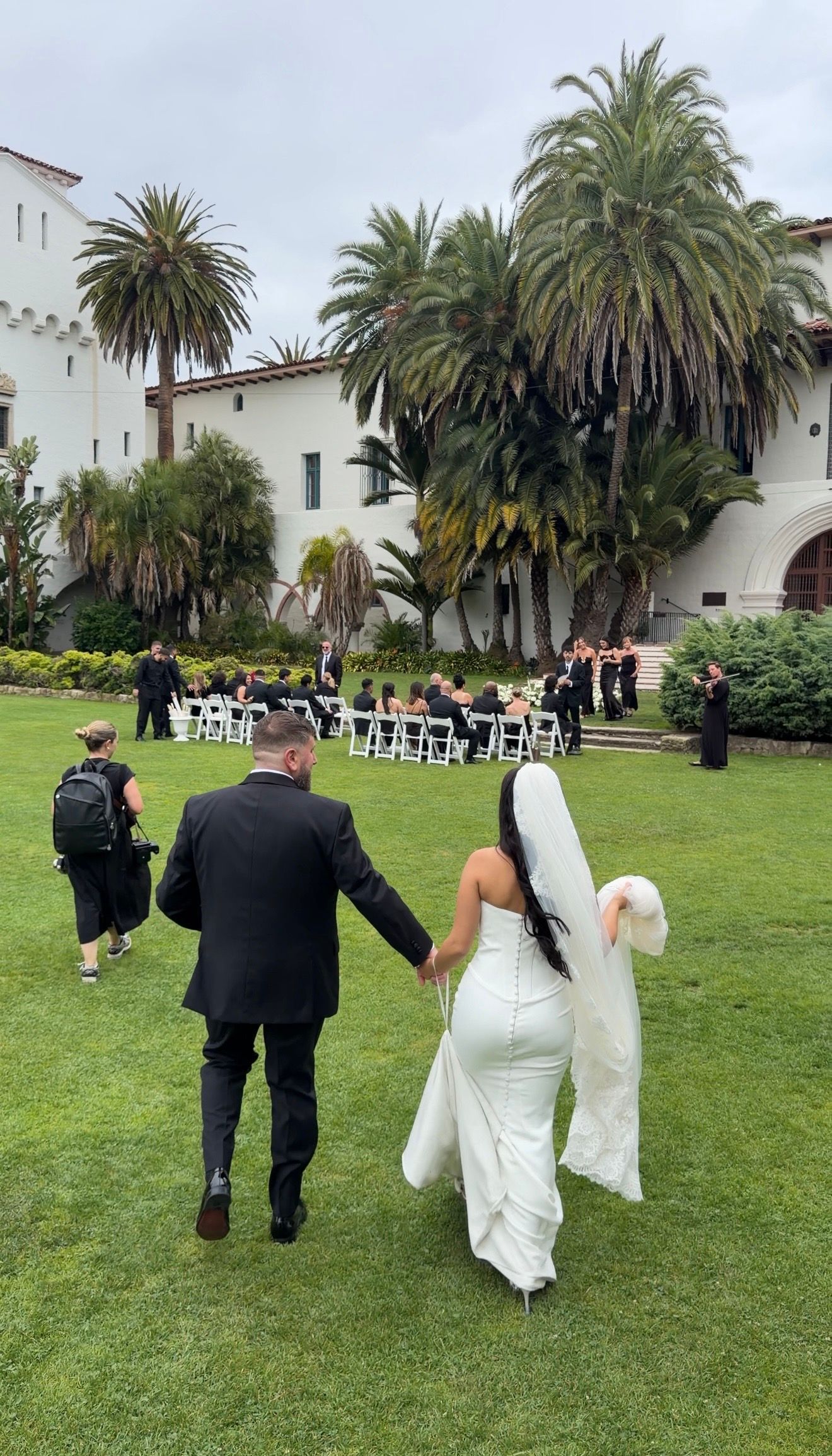 Bride and groom at the Santa Barbara Courthouse during an intimate California elopement documented by a luxury wedding content creator.