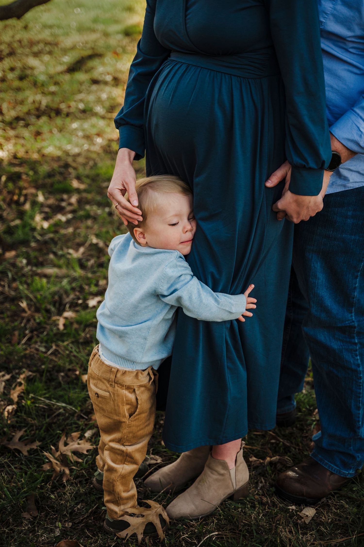 Little boy hugs mom in family maternity session based in Berryville, Clarke County Virginia