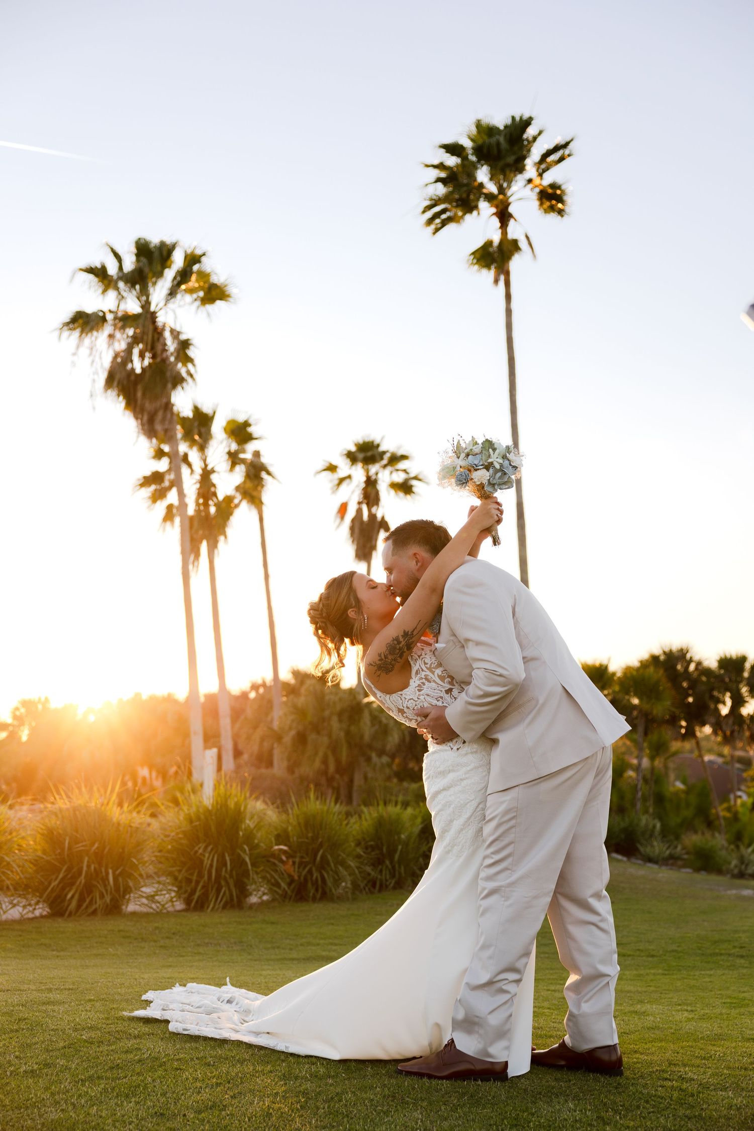 Bride and groom dip kiss at golden hour at Heron Creek Golf & Country Club in Florida, captured by Grand Photo by Karyna Oliinyk