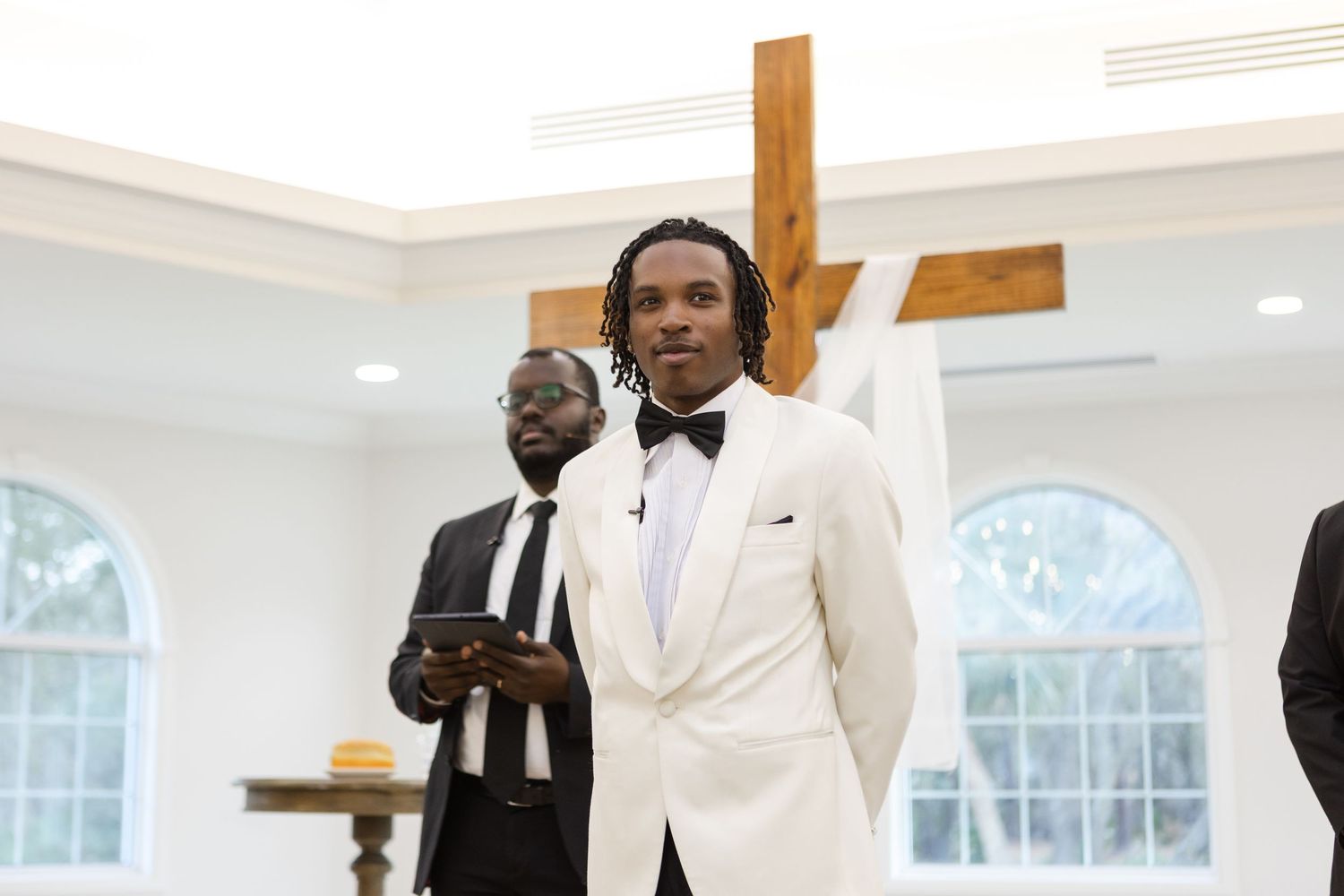Groom seeing bride for  first time during the ceremony at Harborside Chapel in Safety Harbor, Florida — wedding photographer Grand Photo