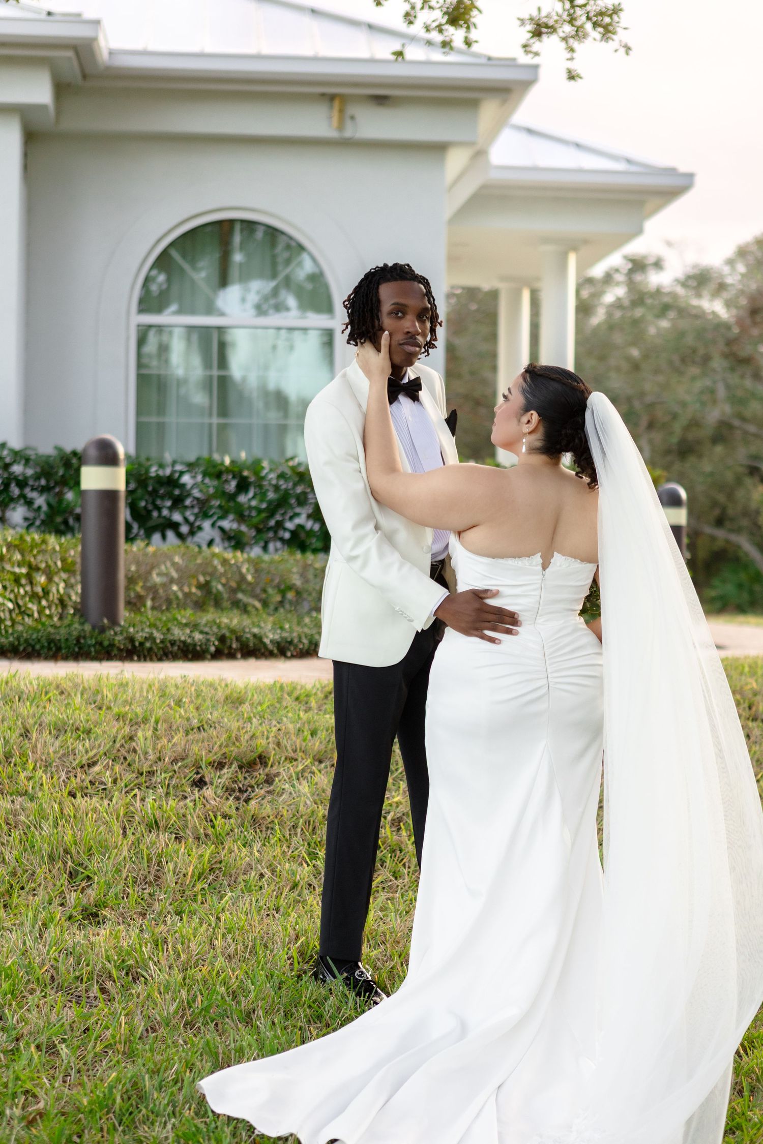International bride and groom portraits at Harborside Chapel in Safety Harbor, Florida — wedding photographer Grand Photo, Karyna Oliinyk