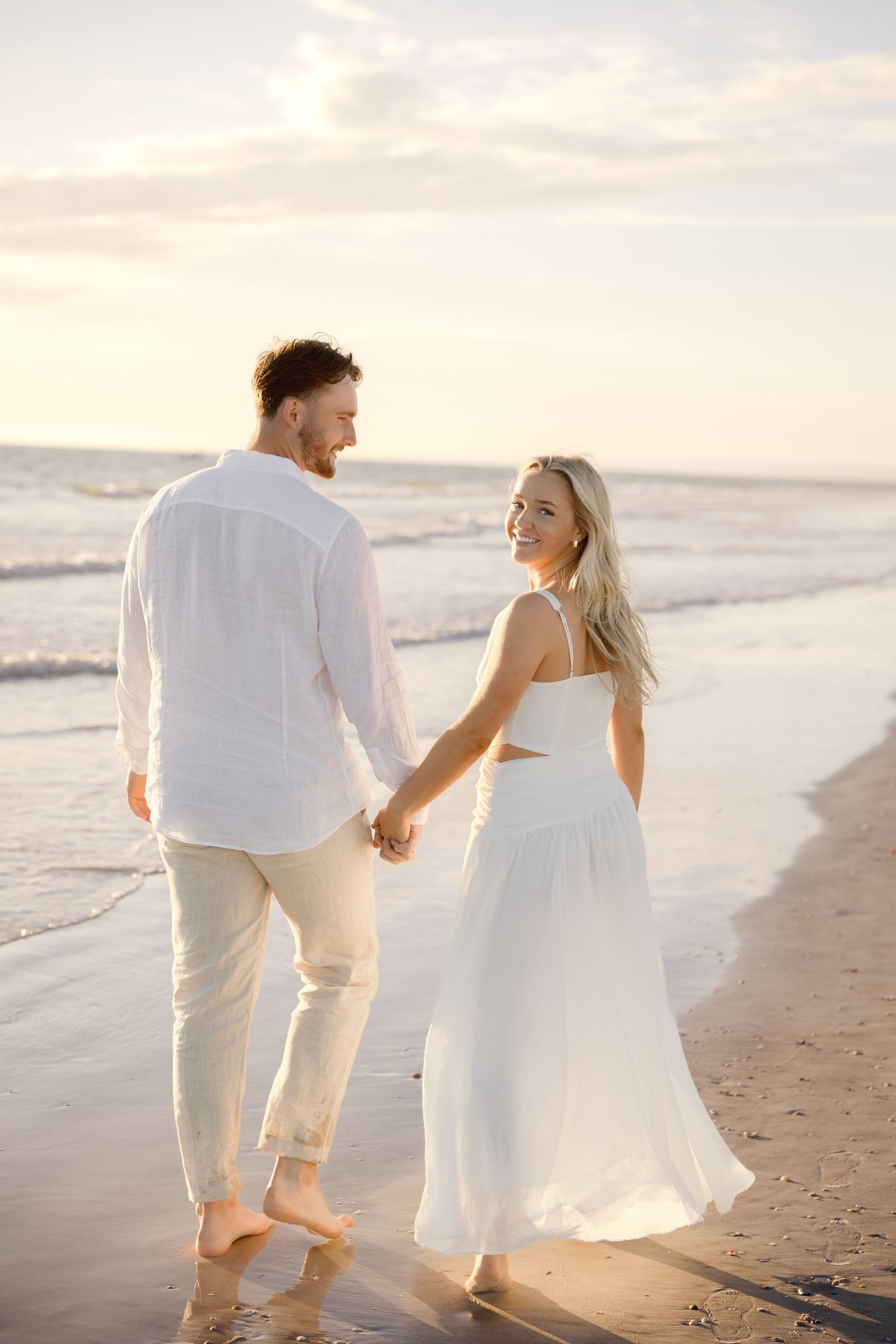 Beach engagement couple session at St. Pete Beach Florida, captured by Grand Photo Karyna Oliinyk