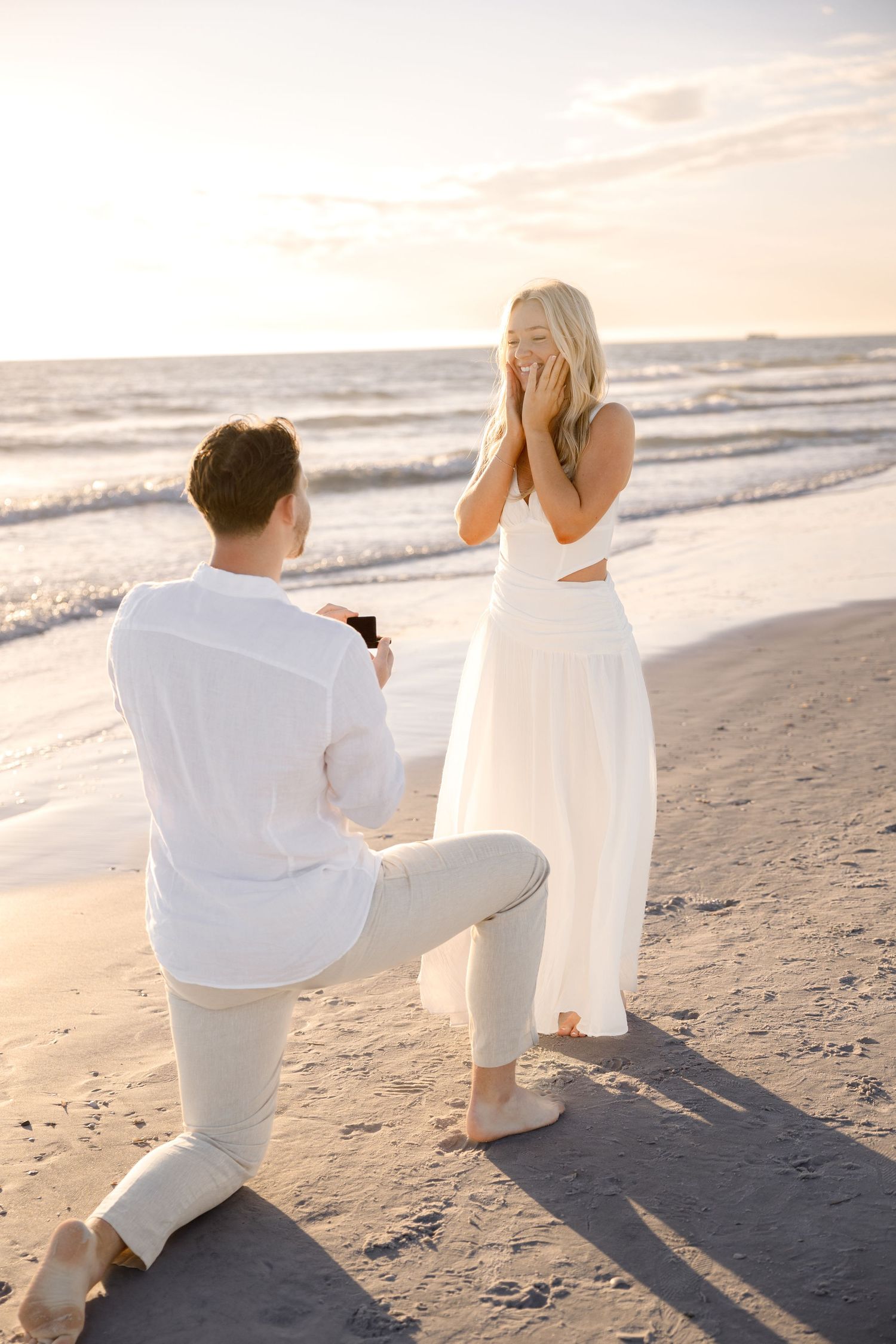 Surprise proposal photography at Anna Maria Island in Sarasota by engagement photographer Grand Photo Karyna Oliinyk