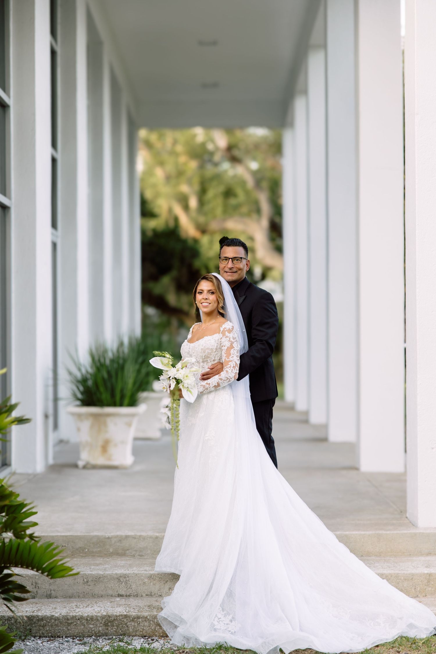 Wedding Portraits of bride and groom at Tampa Garden Club, Florida, captured by Grand Photo by Karyna Oliinyk