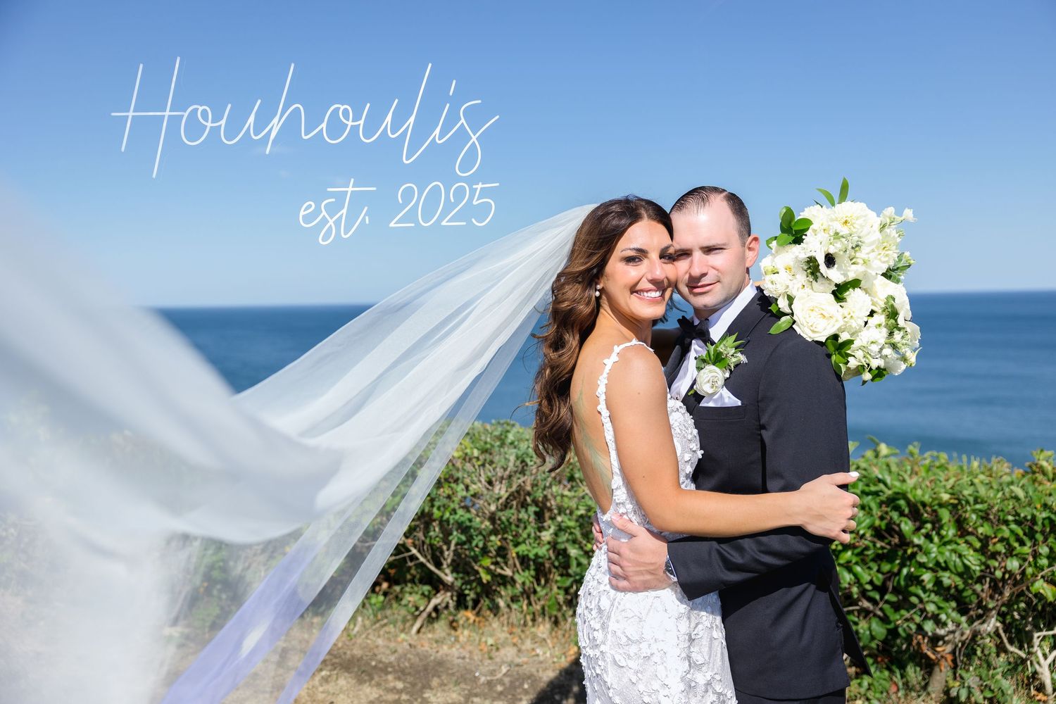 Couple embraces with ocean view, bride’s veil flowing at St. Pete Beach FL, wedding photographer Grand Photo Karyna Oliinyk