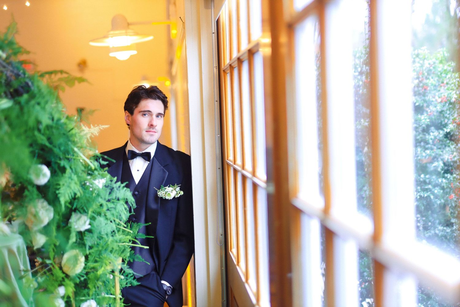 Groom portrait by lush greenery at Saphire Estate in Sharon, Massachusetts, captured by Grand Photo by Karyna Oliinyk